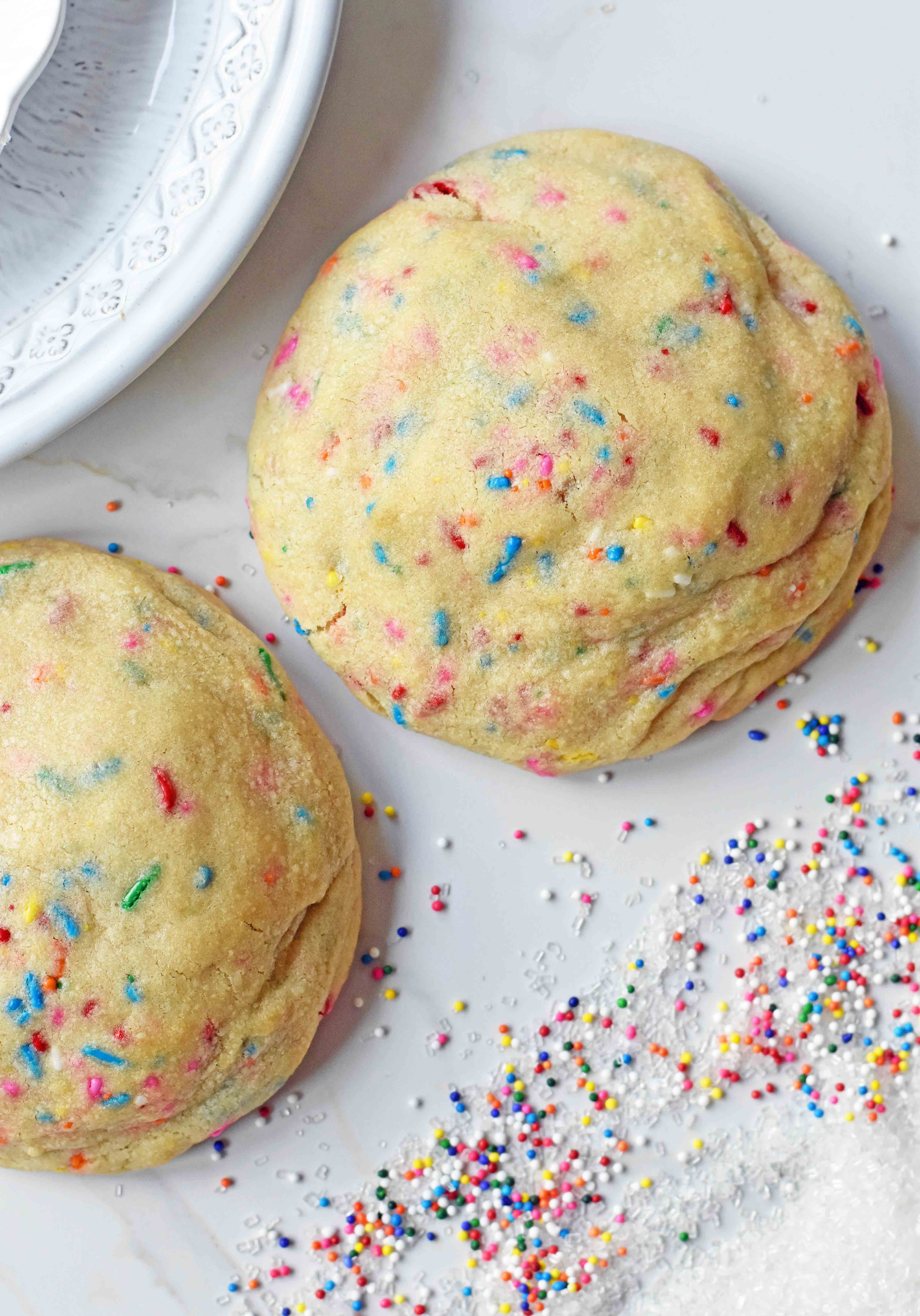 Funfetti Cookies are soft chewy vanilla sugar cookies with rainbow sprinkles. Sprinkles cookies are perfect for birthday parties, graduation, or any celebration. The perfect funfetti cookie made from scratch. www.modernhoney.com