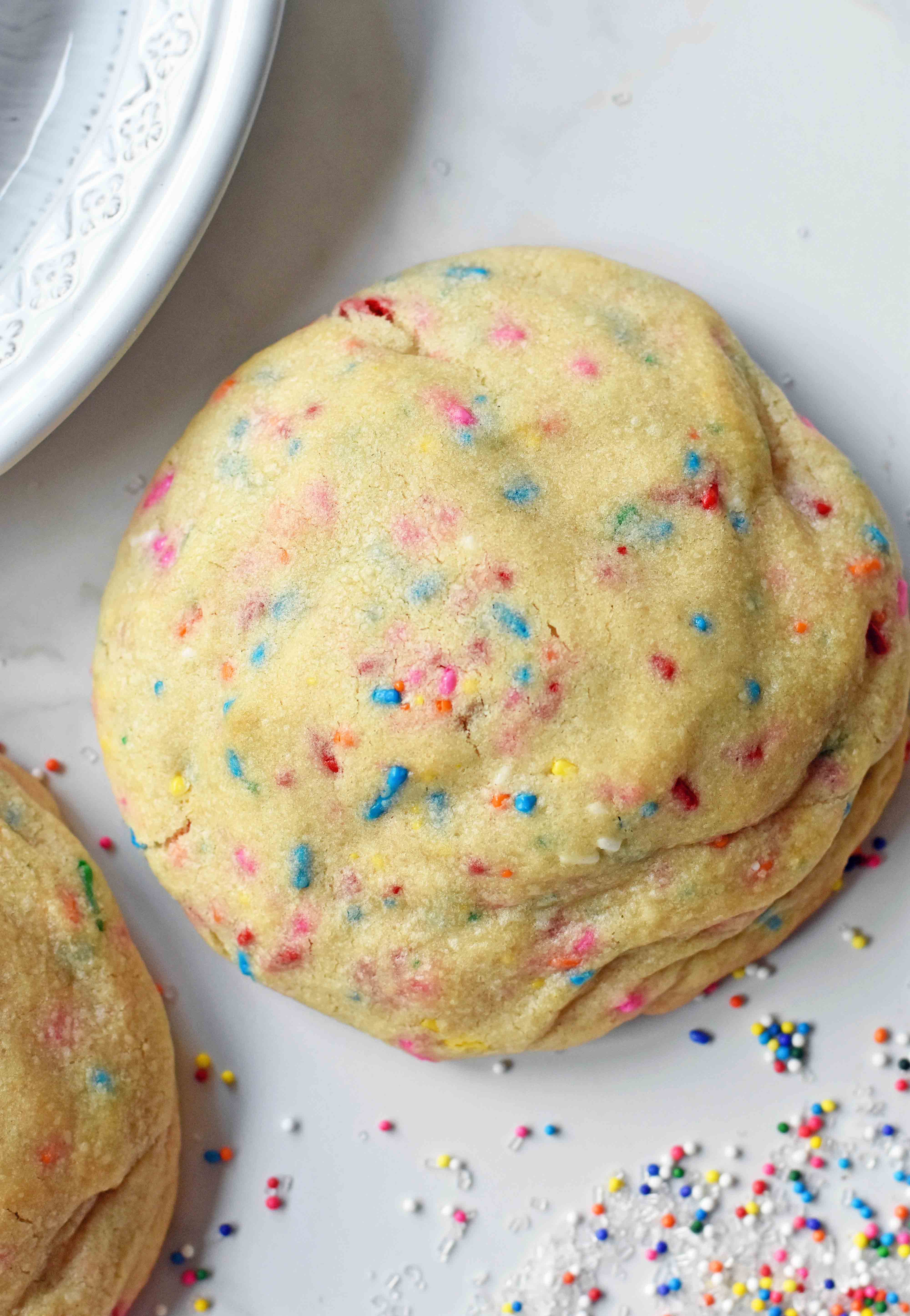 Funfetti Cookies are soft chewy vanilla sugar cookies with rainbow sprinkles. Sprinkles cookies are perfect for birthday parties, graduation, or any celebration. The perfect funfetti cookie made from scratch. www.modernhoney.com