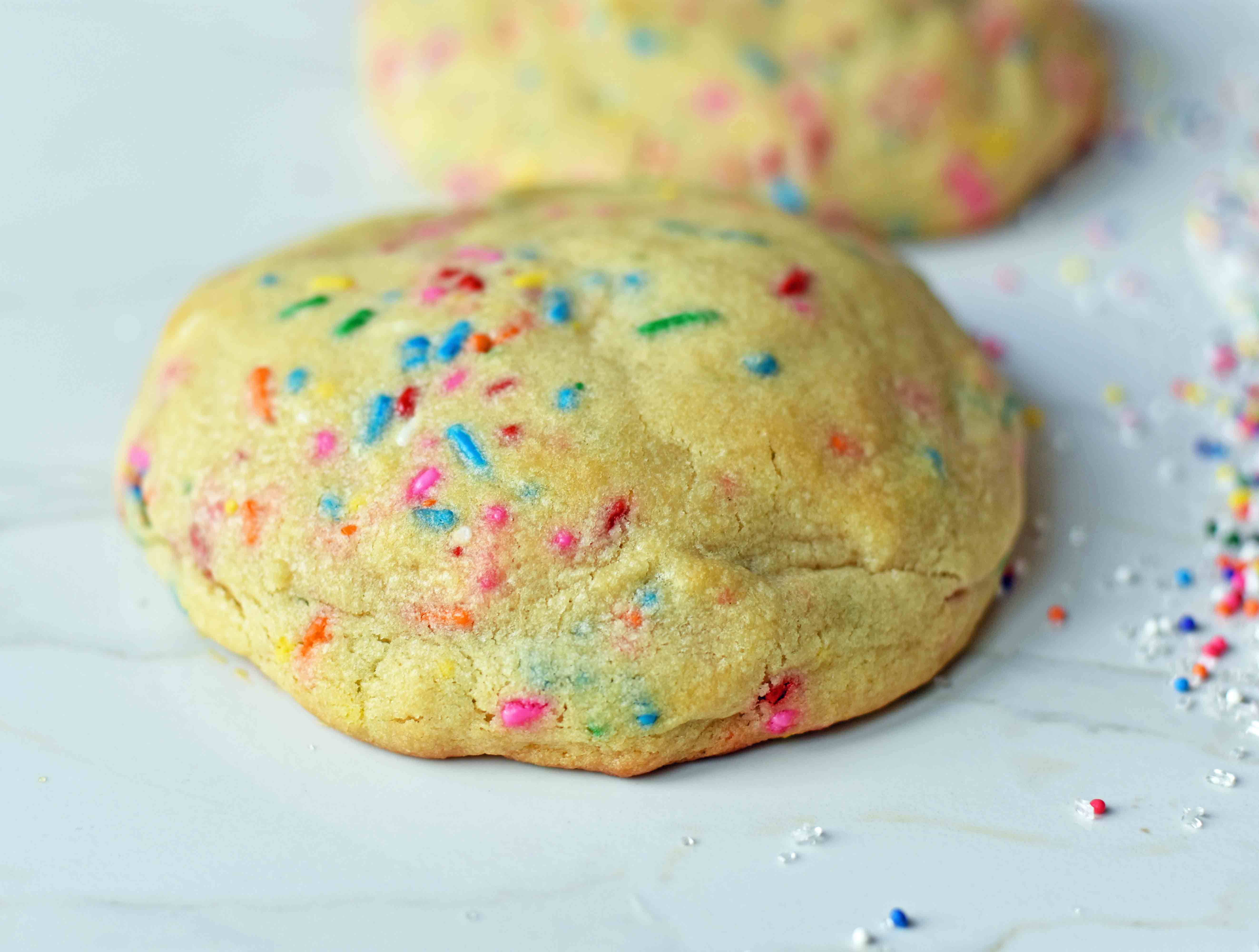 Funfetti Cookies are soft chewy vanilla sugar cookies with rainbow sprinkles. Sprinkles cookies are perfect for birthday parties, graduation, or any celebration. The perfect funfetti cookie made from scratch. www.modernhoney.com