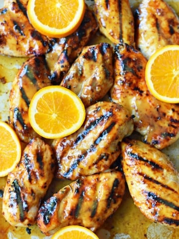 Honey Mustard Grilled Chicken. How to make sweet and tangy grilled honey mustard chicken. A honey mustard marinade and sauce in one! The perfect chicken for your summer BBQ. www.modernhoney.com #honeymustard #honeymustardchicken