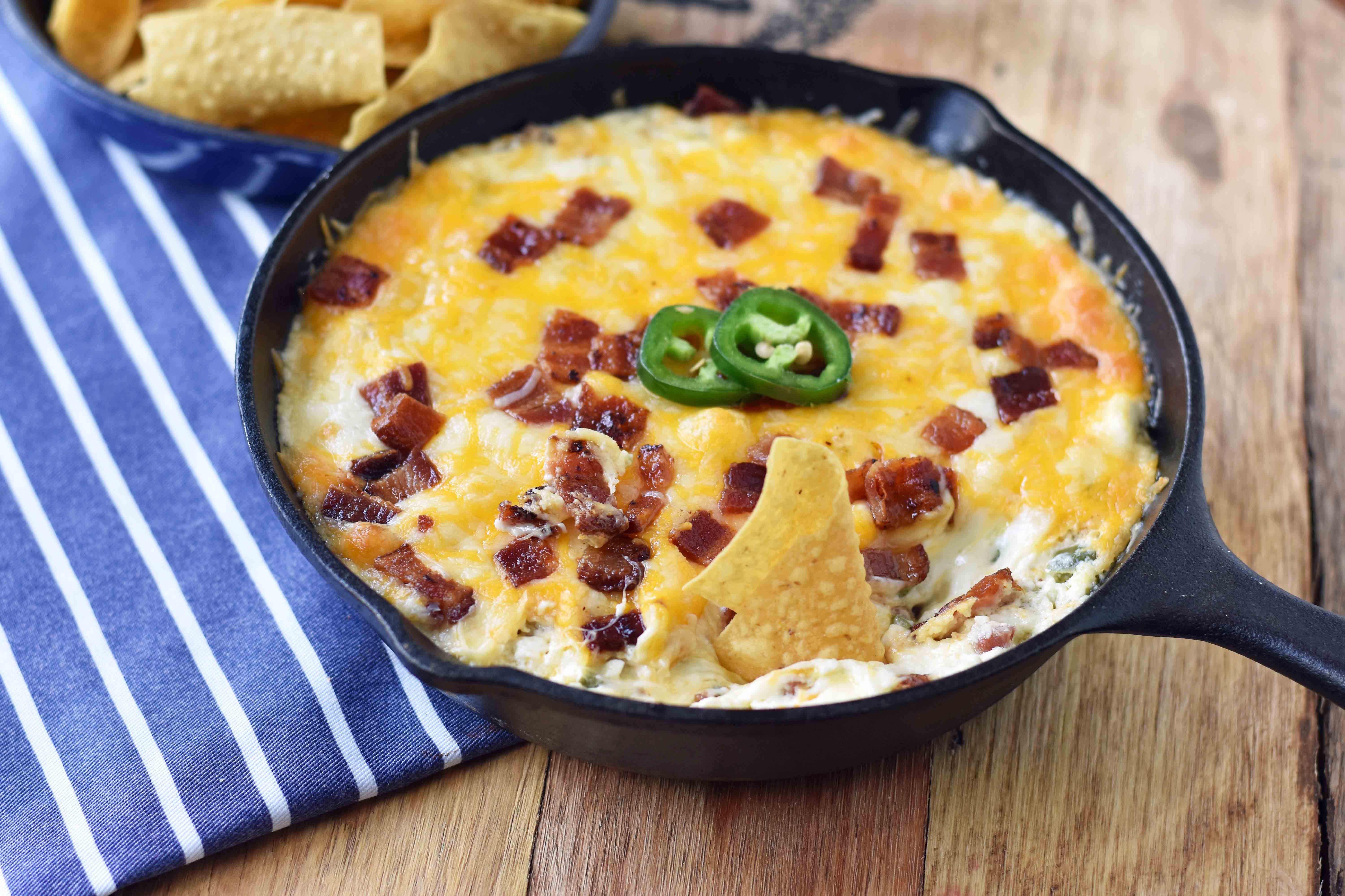 Creamy Jalapeno Popper Dip with Bacon. Homemade Jalapeno Popper Dip made with cream cheese, sour cream, mayo, fresh jalapenos, two kinds of Mexican cheeses, and crispy bacon. The perfect party appetizer. This Jalapeno Popper Dip is so popular! www.modernhoney.com
