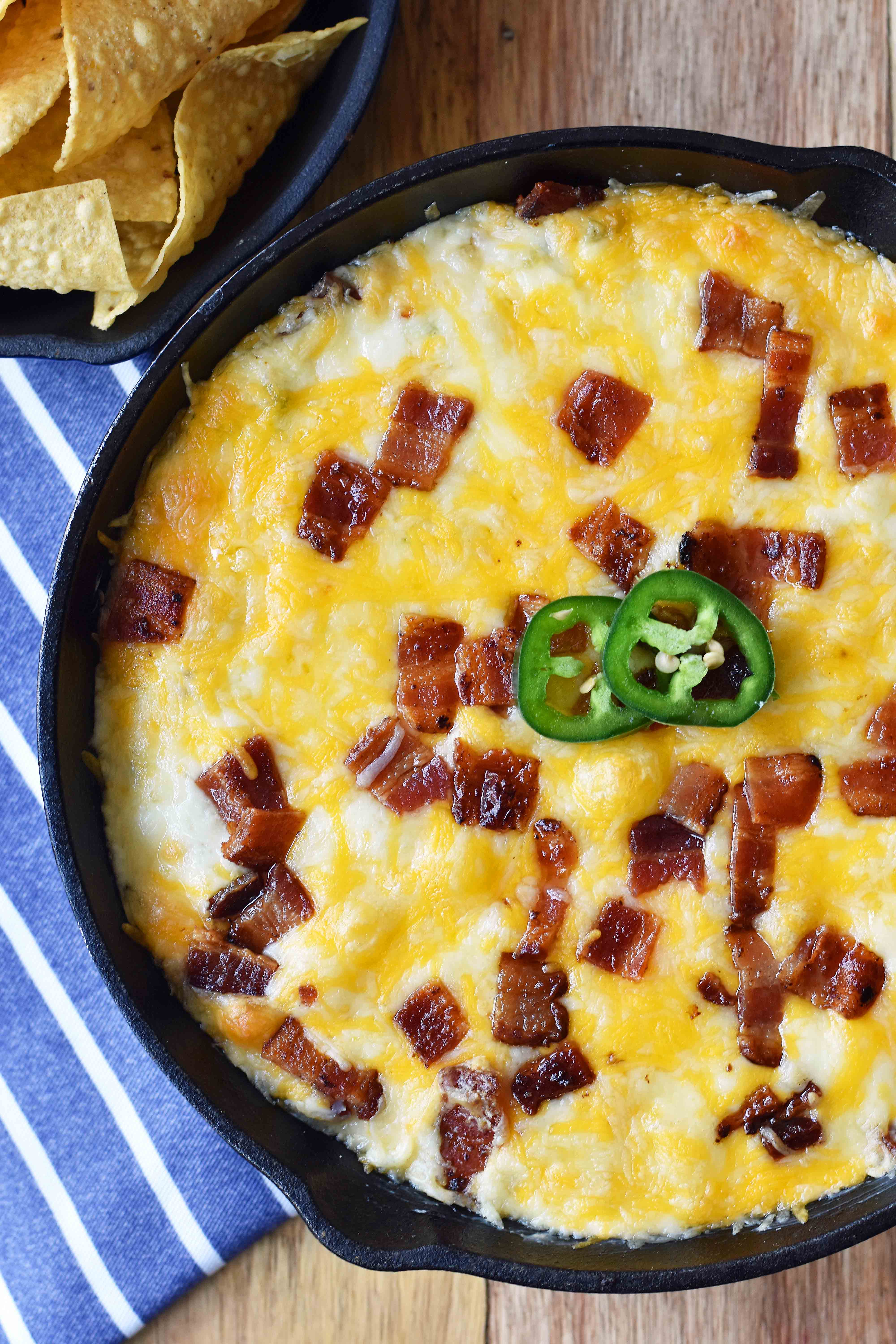 Creamy Jalapeno Popper Dip with Bacon. Homemade Jalapeno Popper Dip made with cream cheese, sour cream, mayo, fresh jalapenos, two kinds of Mexican cheeses, and crispy bacon. The perfect party appetizer. This Jalapeno Popper Dip is so popular! www.modernhoney.com