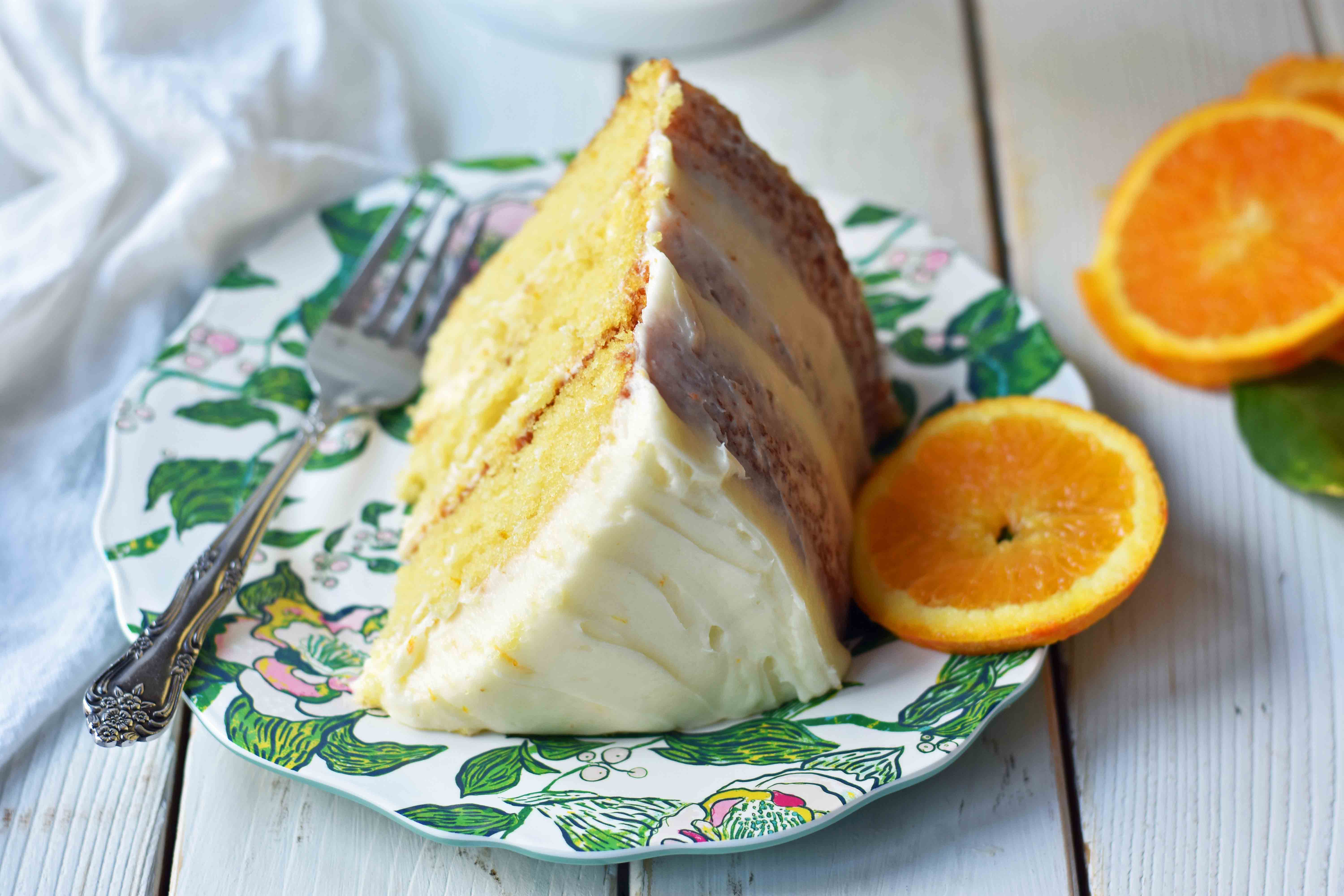 Homemade Orange Cake with Sweet Orange Cream Cheese Frosting. How to make the best orange cake. Orange cake with orange frosting. Naked orange cake. www.modernhoney.com #cake #orangecake #nakedcake #nakedorangecake