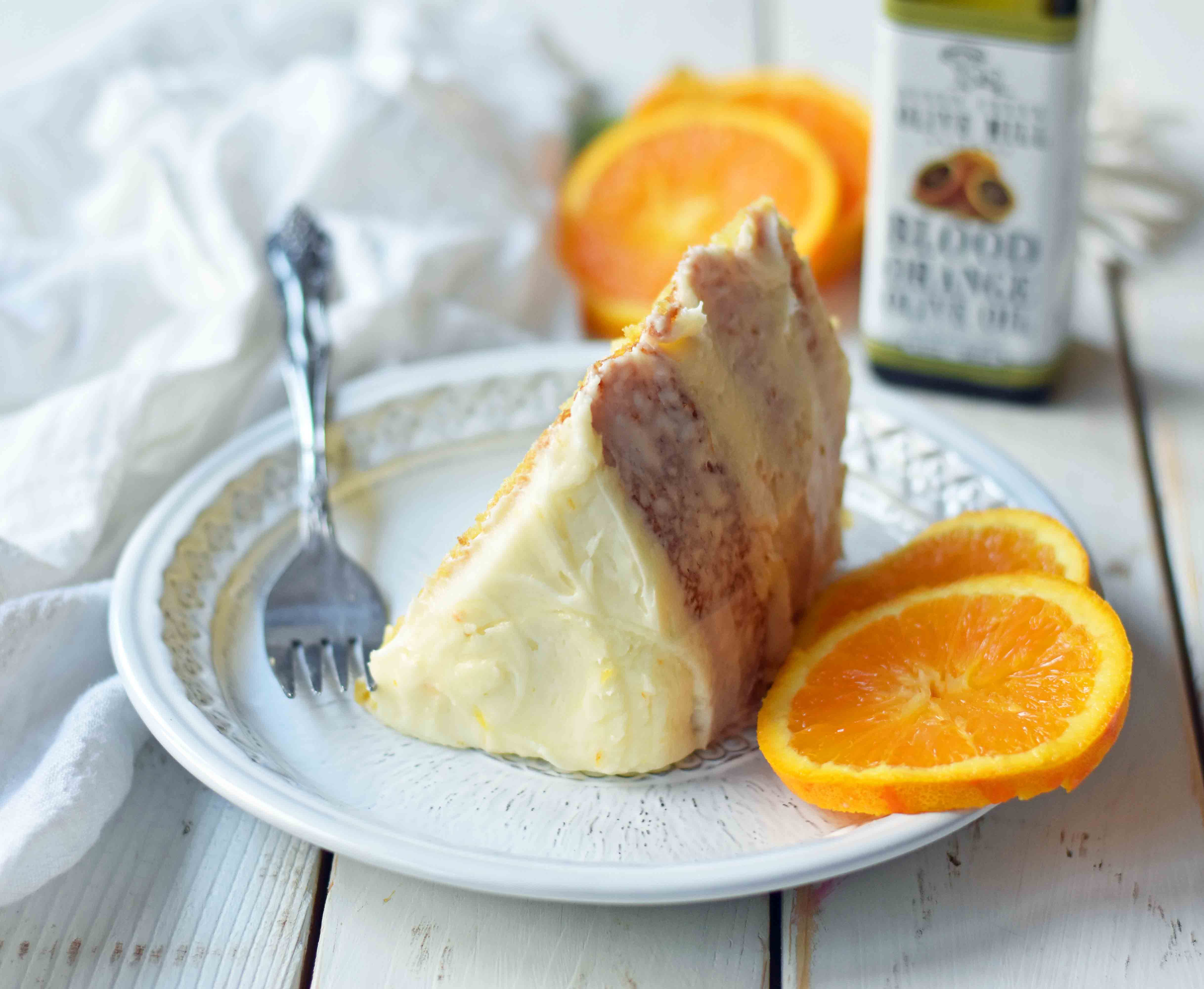 Homemade Orange Cake with Sweet Orange Cream Cheese Frosting. How to make the best orange cake. Orange cake with orange frosting. Naked orange cake. www.modernhoney.com #cake #orangecake #nakedcake #nakedorangecake