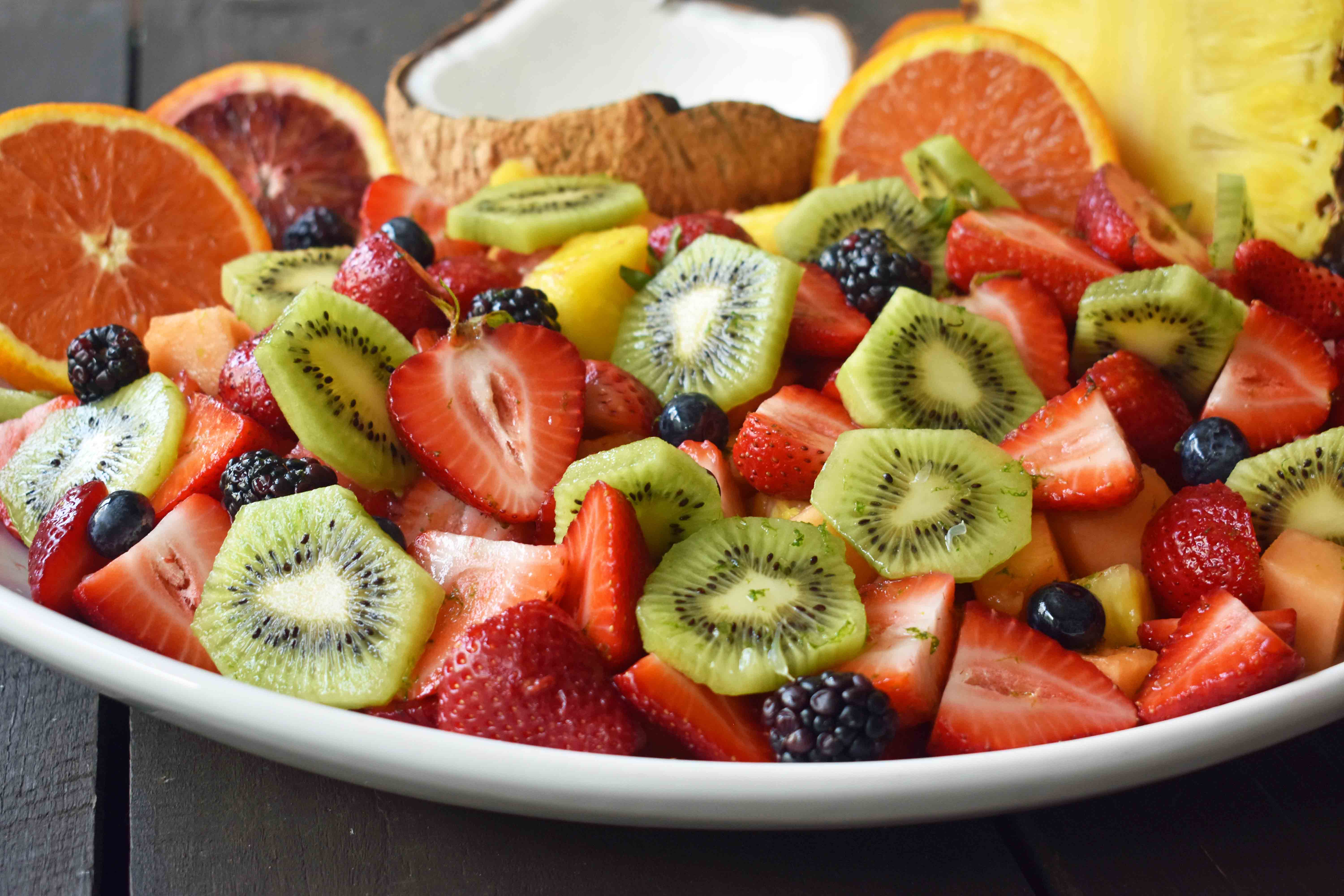 Summer Fruit Salad with Honey Lime Dressing. A healthy side dish! Vibrant fresh fruit with a citrus orange lime honey dressing. www.modernhoney.com