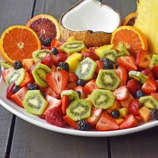 Summer Fruit Salad with Honey Lime Dressing. A healthy side dish! Vibrant fresh fruit with a citrus orange lime honey dressing. www.modernhoney.com