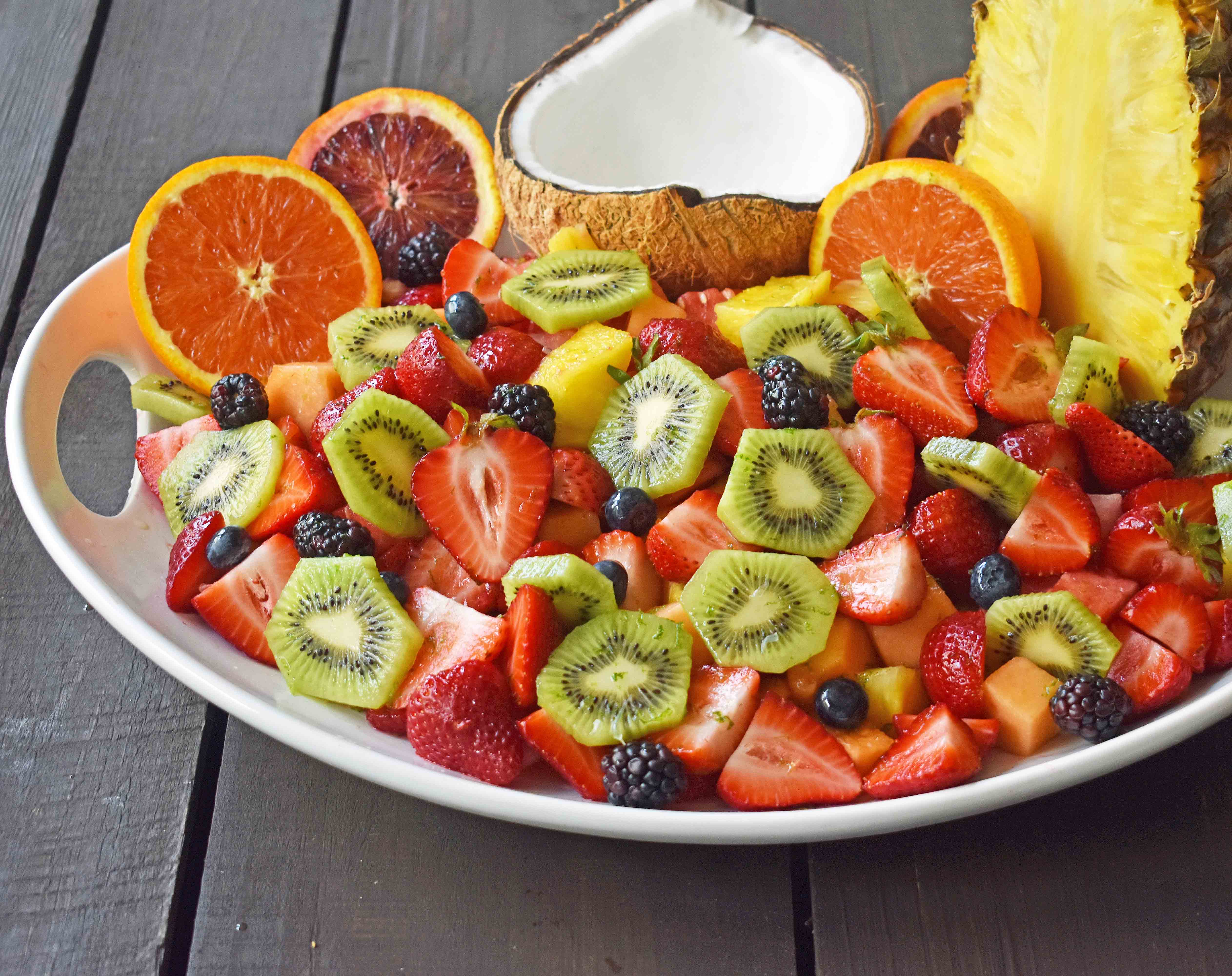 Summer Fruit Salad with Honey Lime Dressing. A healthy side dish! Vibrant fresh fruit with a citrus orange lime honey dressing. www.modernhoney.com