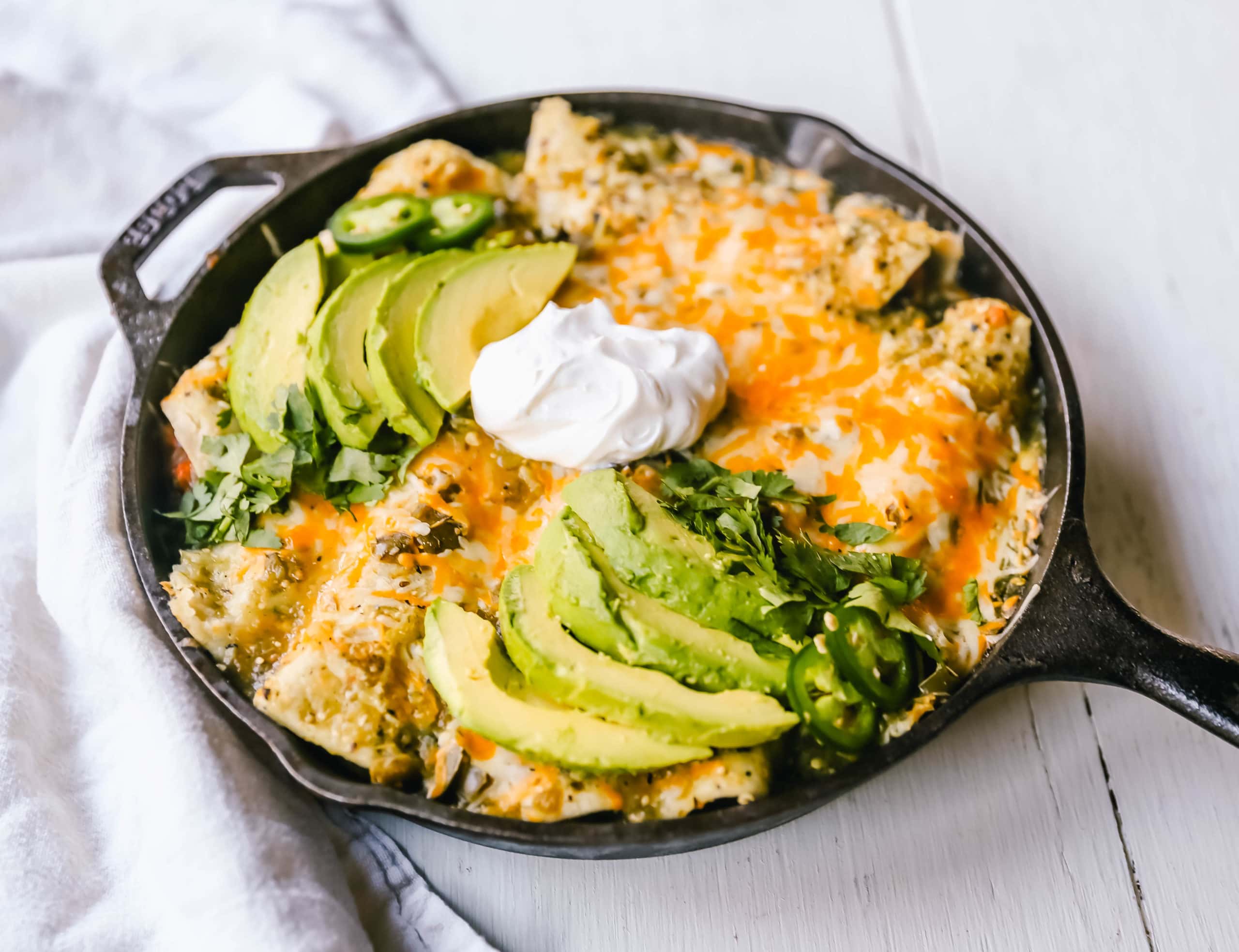 Sweet Potato Black Bean Enchiladas with Salsa Verde  Black beans, sweet potatoes, and roasted poblano chilies rolled into corn tortillas and topped with salsa verde and Mexican cheeses. www.modernhoney.com #vegetableenchiladas #enchiladas