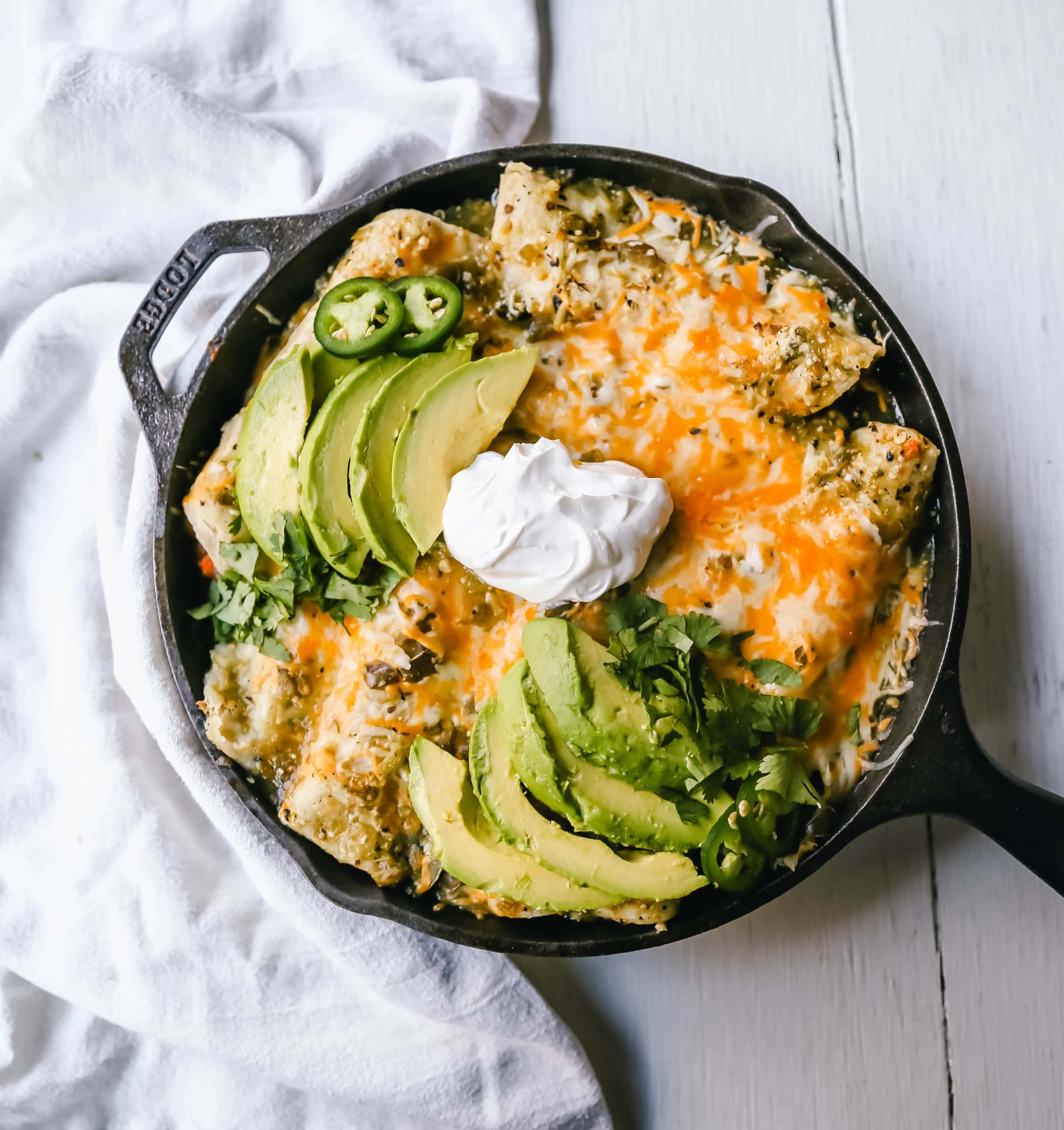 Sweet Potato Black Bean Enchiladas with Salsa Verde  Black beans, sweet potatoes, and roasted poblano chilies rolled into corn tortillas and topped with salsa verde and Mexican cheeses. www.modernhoney.com #vegetableenchiladas #enchiladas