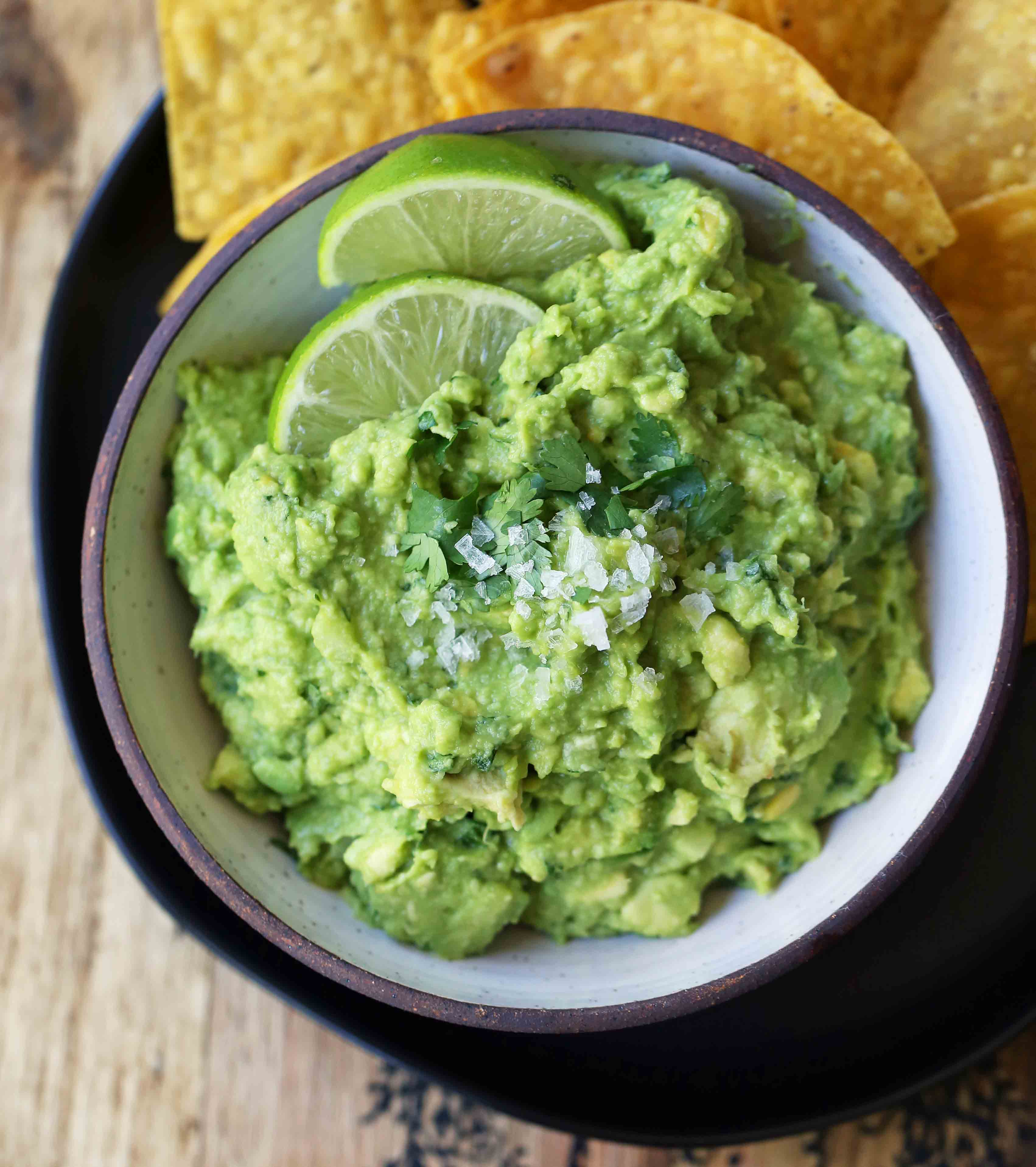 The Best Guacamole Recipe. How to make authentic Mexican guacamole. Simple perfect guacamole made with the freshest ingredients. www.modernhoney.com #guacamole #bestguacamole #avocados