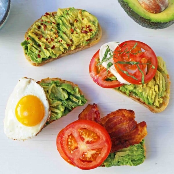 Avocado Toast -- 4 Ways. How to make perfect avocado toast. Caprese Avocado Toast, BAT Bacon Avocado Tomato Avocado Toast, Fried Egg Avocado Toast, Avocado Toast with Sea Salt and Chili Flakes. Tips and tricks for making the best avocado toast. www.modernhoney.com #avocadotoast #avocados #avocado