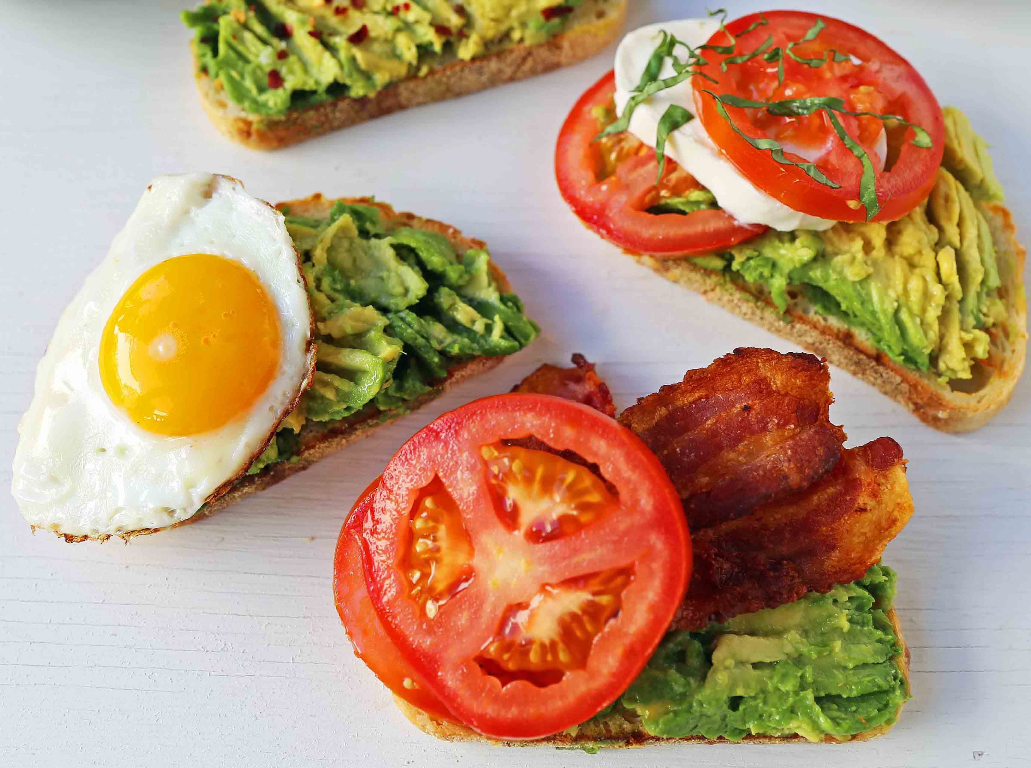 Avocado Toast -- 4 Ways. How to make perfect avocado toast. Caprese Avocado Toast, BAT Bacon Avocado Tomato Avocado Toast, Fried Egg Avocado Toast, Avocado Toast with Sea Salt and Chili Flakes. Tips and tricks for making the best avocado toast. www.modernhoney.com #avocadotoast #avocados #avocado