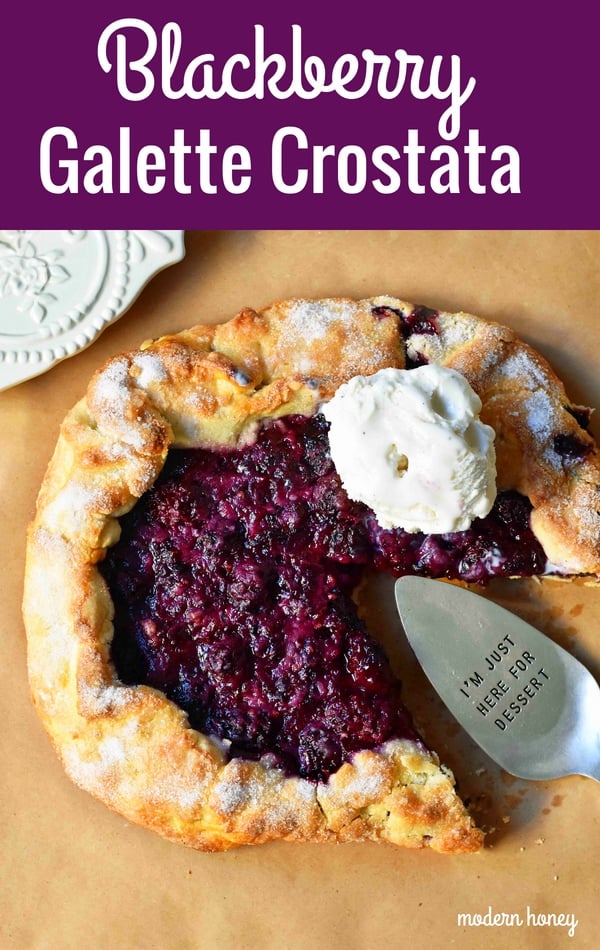 Blackberry Galette Crostata. An easy rustic summer dessert made with homemade buttery flaky pie crust with a sweet blackberry filling topped with vanilla bean ice cream. A much easier blackberry pie! www.modernhoney.com #galette #crostata #blackberrycrostata #blackberrygalette #summerdessert #berrydessert