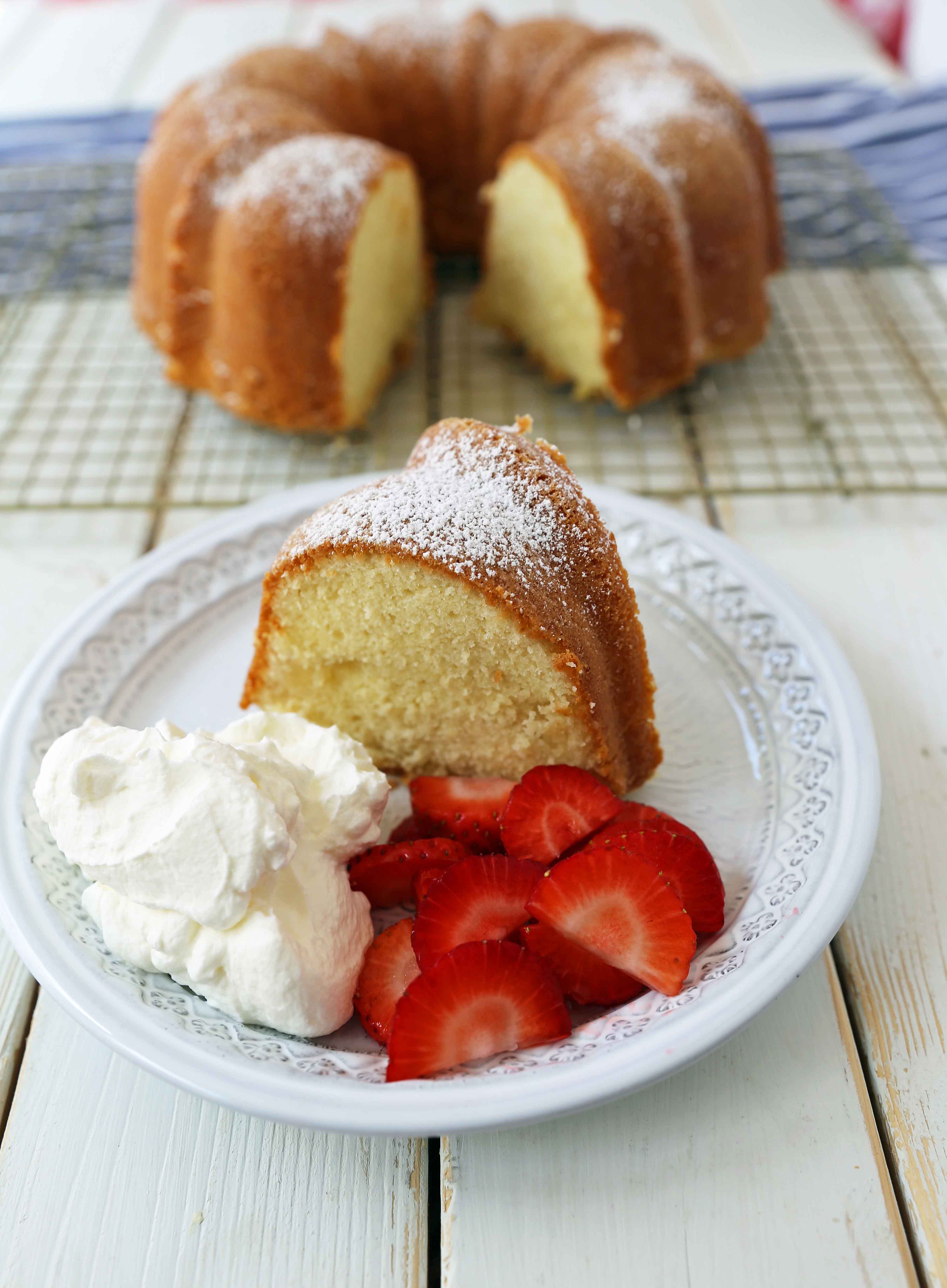 The BEST Cream Cheese Pound Cake with fresh strawberries and whipped cream. How to make the perfect pound cake in a bundt pan. Buttery cream cheese pound cake goes with everything! This is such a popular cake that is wonderful on its own or in a trifle or berry compote. www.modernhoney.com #poundcake #bundtcake #cake #creamcheesecake