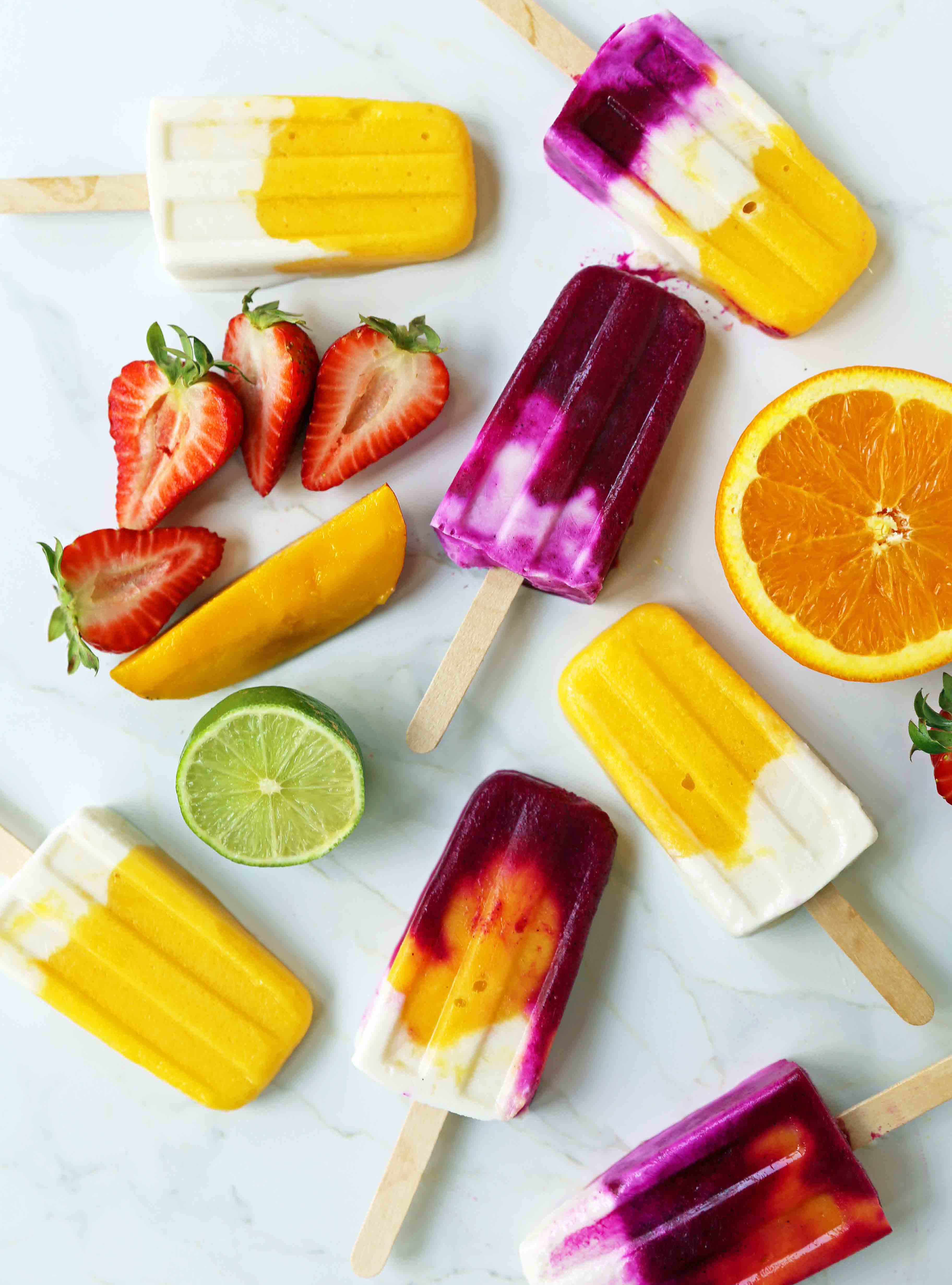 Homemade Fruit Popsicles Recipe. Fruit and Cream Popsicles. How to make homemade fruit and cream popsicles. Mango and Cream Popsicles. Pitaya and Cream Popsicles. Peaches and Cream Popsicles. Pitaya Strawberry Popsicles. www.modernhoney.com #popsicles #fruitpopsicles #fruitandcreampopsicles #homemadepopsicles