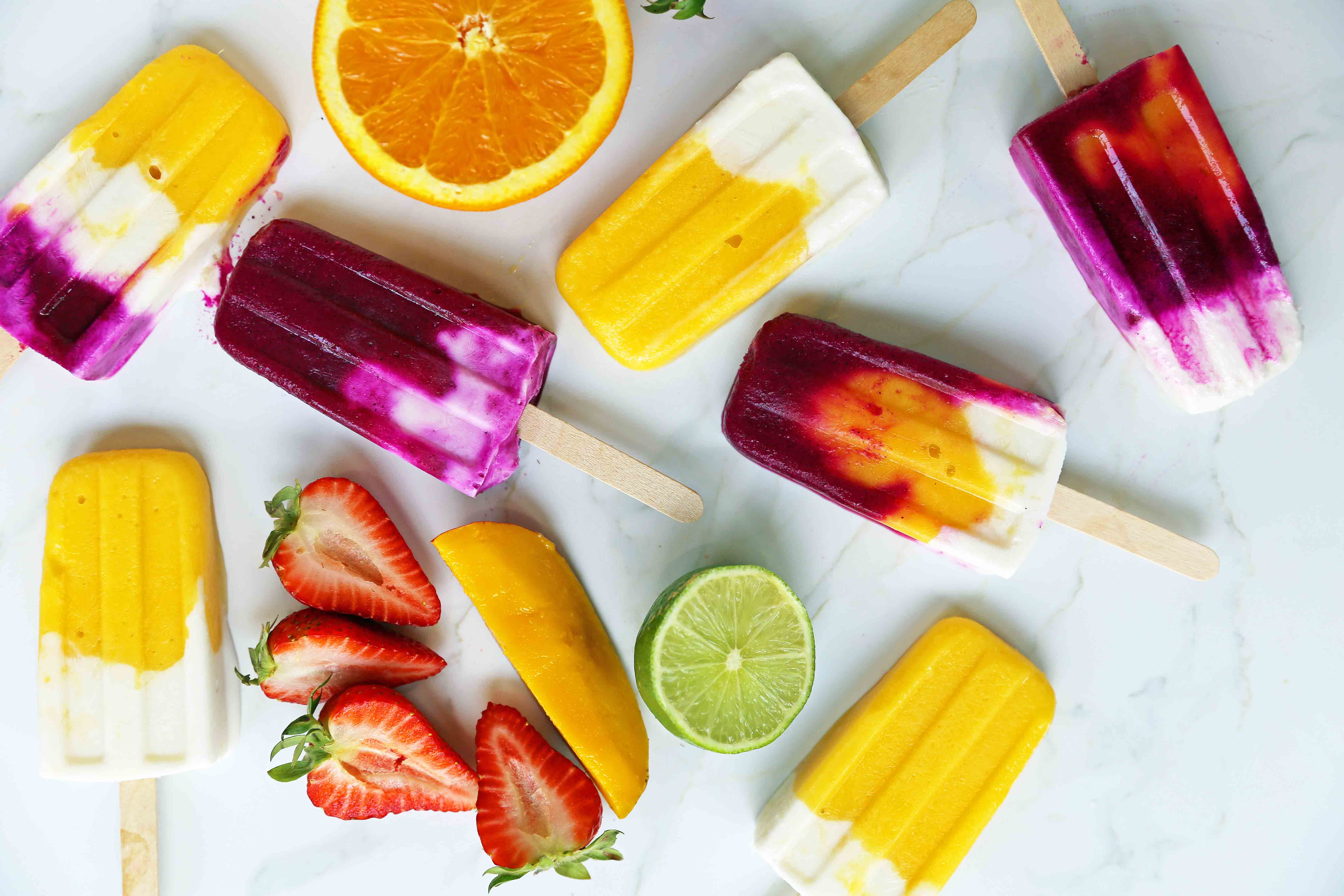 Homemade Fruit Popsicles Recipe. Fruit and Cream Popsicles. How to make homemade fruit and cream popsicles. Mango and Cream Popsicles. Pitaya and Cream Popsicles. Peaches and Cream Popsicles. Pitaya Strawberry Popsicles. www.modernhoney.com #popsicles #fruitpopsicles #fruitandcreampopsicles #homemadepopsicles