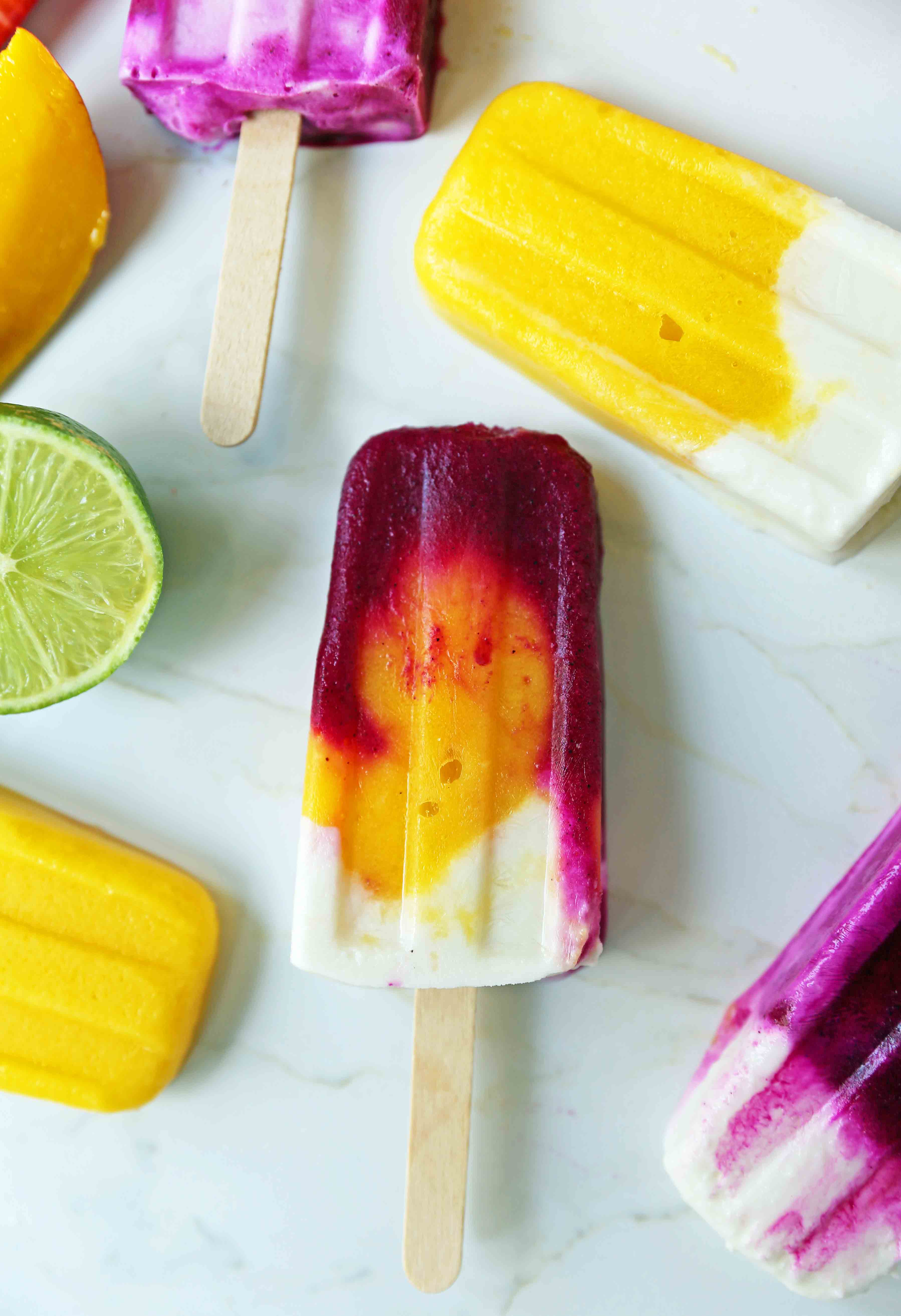 Homemade Fruit Popsicles Recipe. Fruit and Cream Popsicles. How to make homemade fruit and cream popsicles. Mango and Cream Popsicles. Pitaya and Cream Popsicles. Peaches and Cream Popsicles. Pitaya Strawberry Popsicles. www.modernhoney.com #popsicles #fruitpopsicles #fruitandcreampopsicles #homemadepopsicles