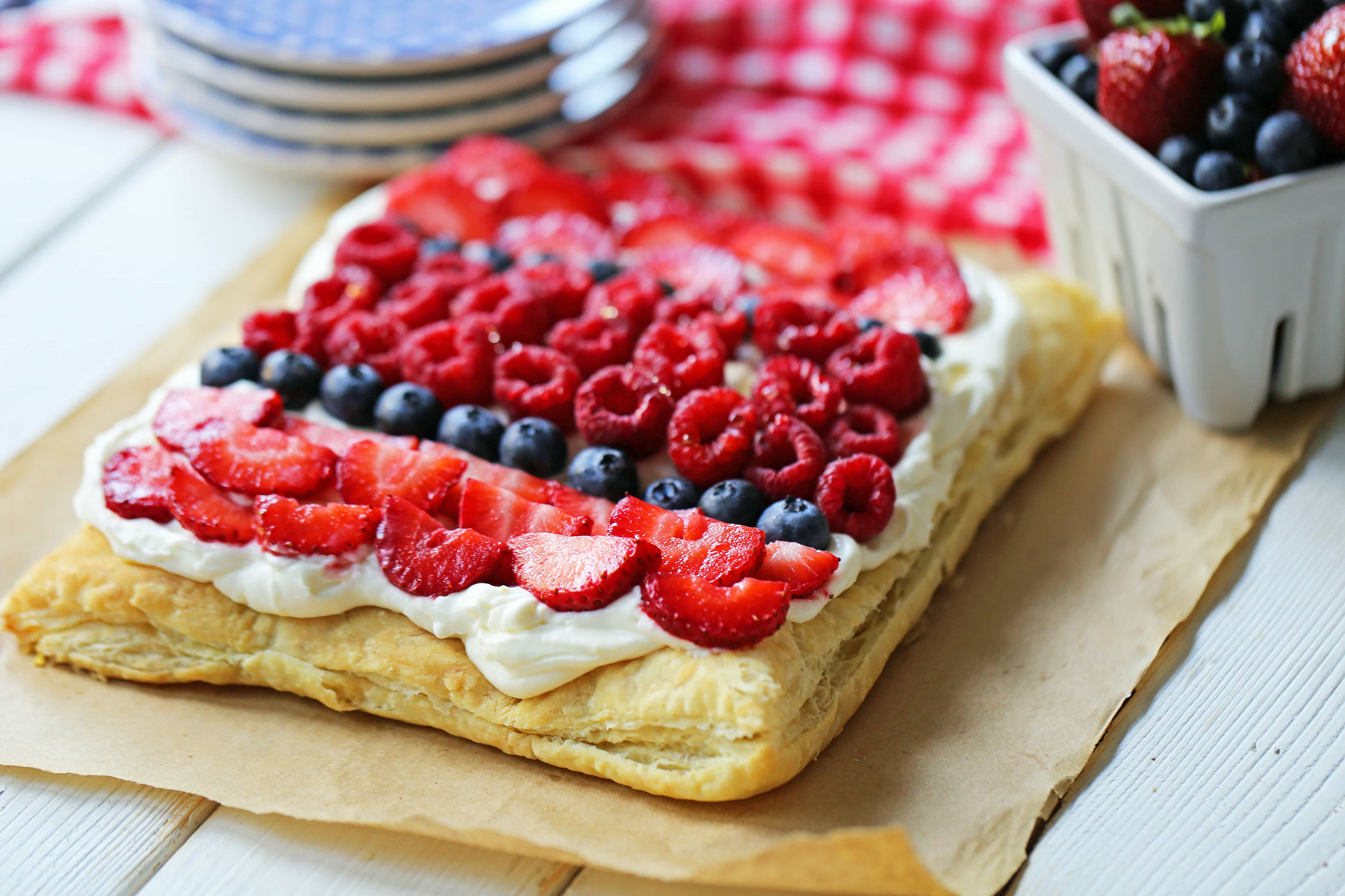 Lemon Berry Cheesecake Puff Pastry Baked Puff Pastry topped with Lemon Cheesecake Filling and Fresh Berries. An easy, beautiful, festive summer dessert. www.modernhoney.com