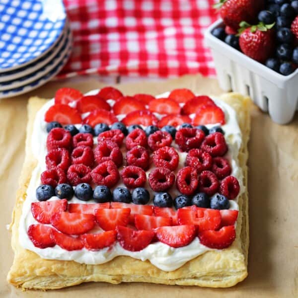 Lemon Berry Cheesecake Puff Pastry Baked Puff Pastry topped with Lemon Cheesecake Filling and Fresh Berries. An easy, beautiful, festive summer dessert. www.modernhoney.com