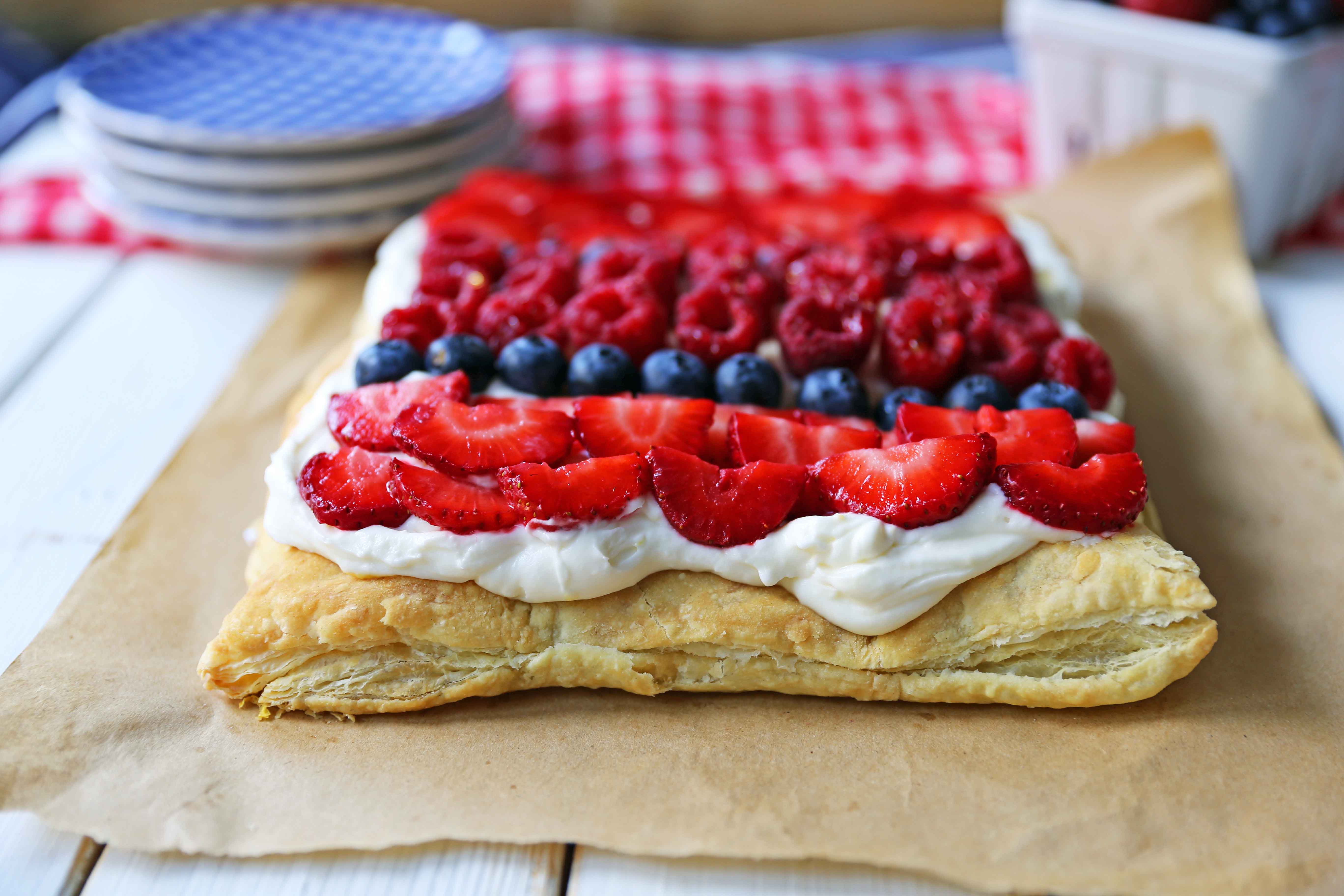 Lemon Berry Cheesecake Puff Pastry Baked Puff Pastry topped with Lemon Cheesecake Filling and Fresh Berries. An easy, beautiful, festive summer dessert. www.modernhoney.com