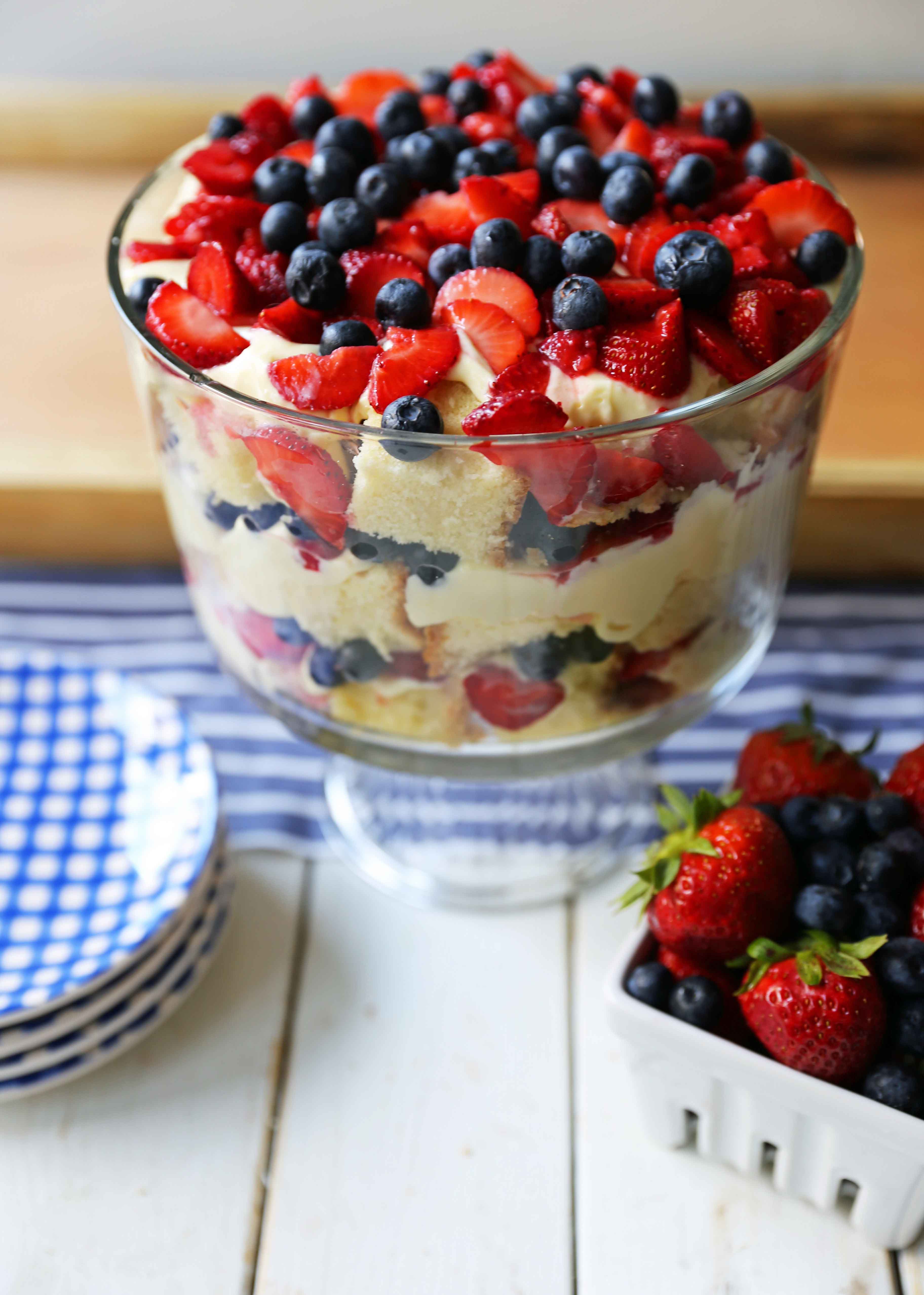 Summer Berry Trifle made with homemade cream cheese pound cake, creamy custard filling, and sweet fruit. A gorgeous summer dessert! Perfect dessert for a potluck and party. Patriotic 4th of July dessert. www.modernhoney.com #trifle #4thofJuly #patrioticdessert #trifle