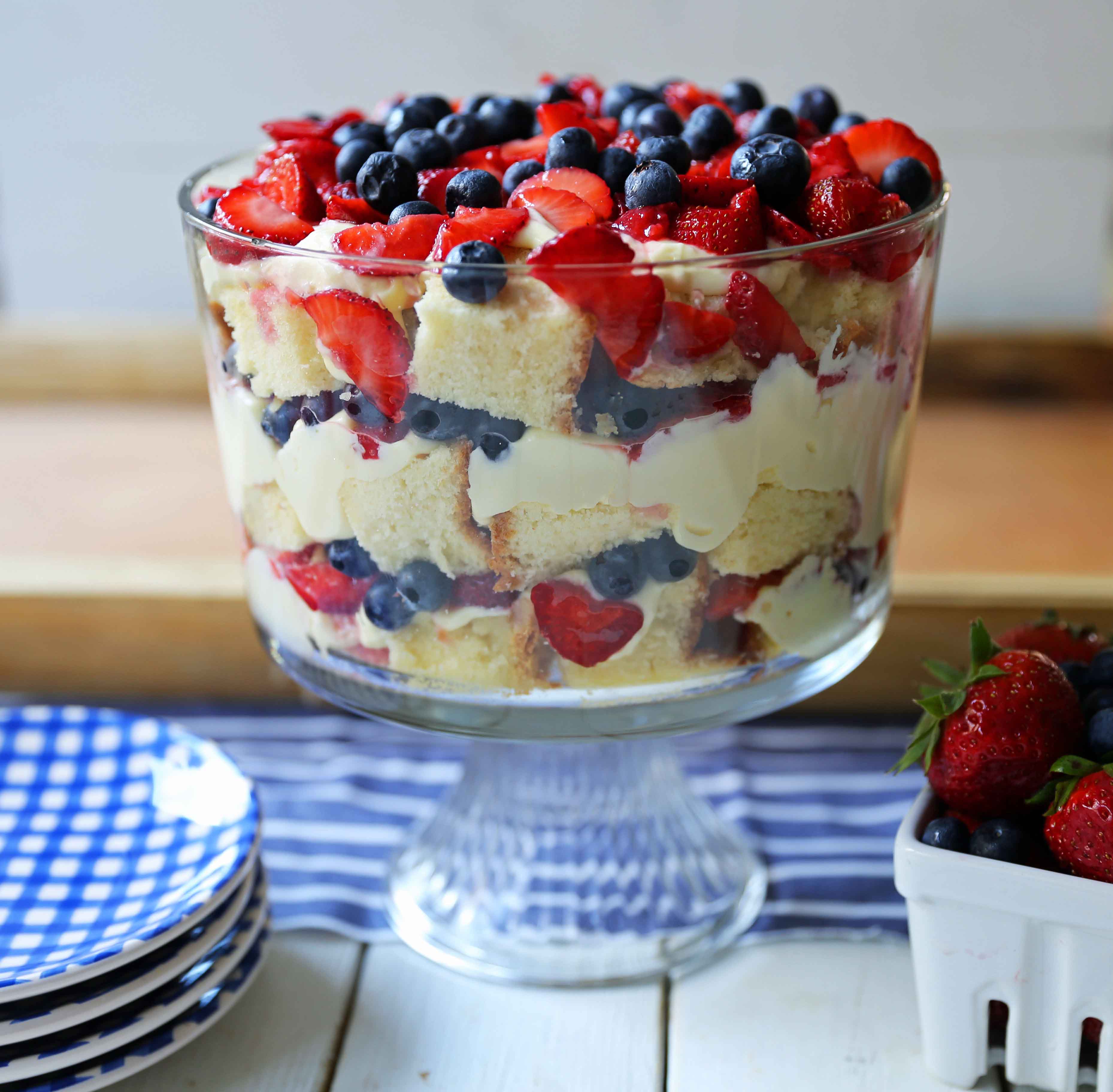 Summer Berry Trifle made with homemade cream cheese pound cake, creamy custard filling, and sweet fruit. A gorgeous summer dessert! Perfect dessert for a potluck and party. Patriotic 4th of July dessert. www.modernhoney.com #trifle #4thofJuly #patrioticdessert #trifle