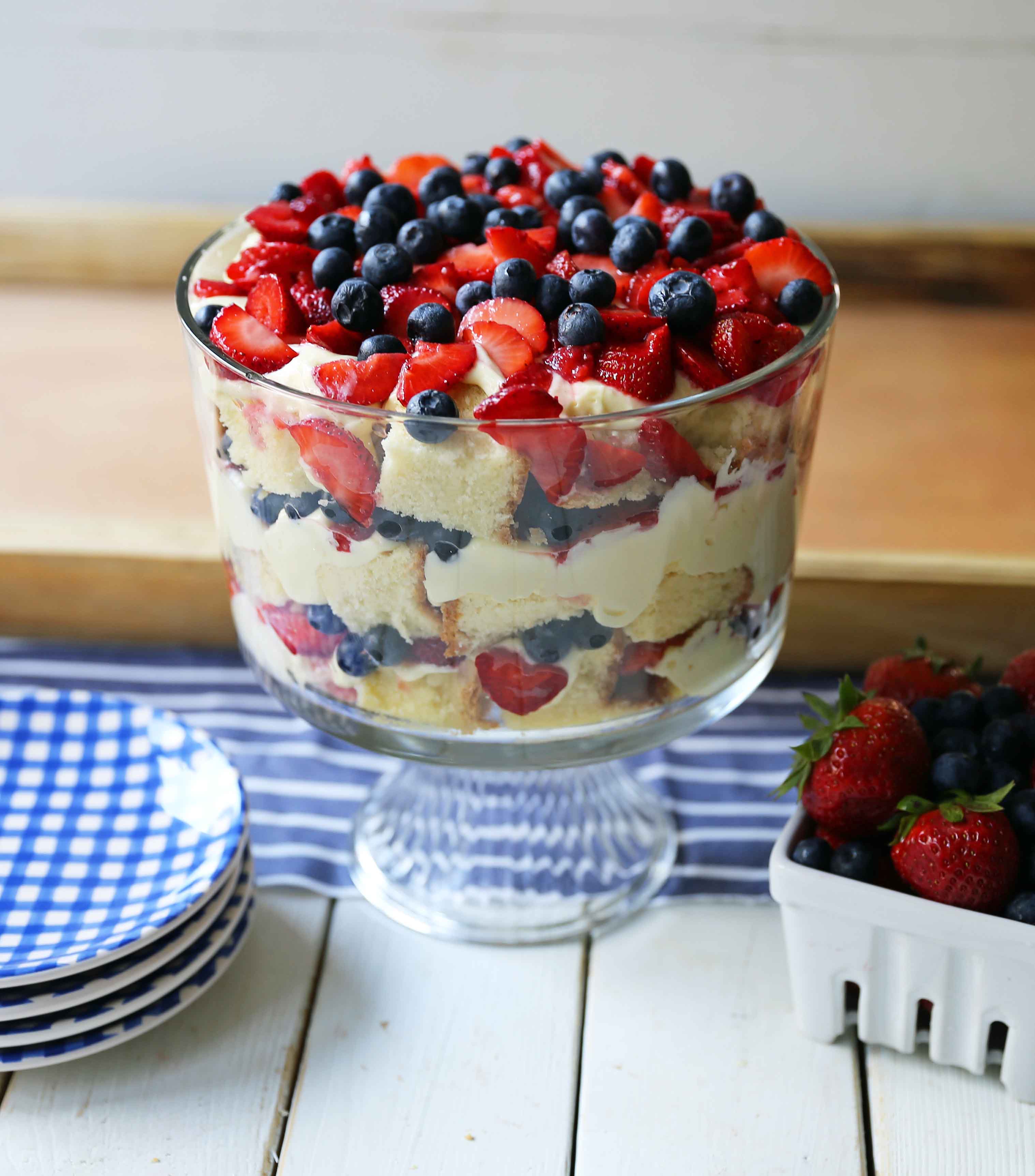 Summer Berry Trifle made with homemade cream cheese pound cake, creamy custard filling, and sweet fruit. A gorgeous summer dessert! Perfect dessert for a potluck and party. Patriotic 4th of July dessert. www.modernhoney.com #trifle #4thofJuly #patrioticdessert #trifle