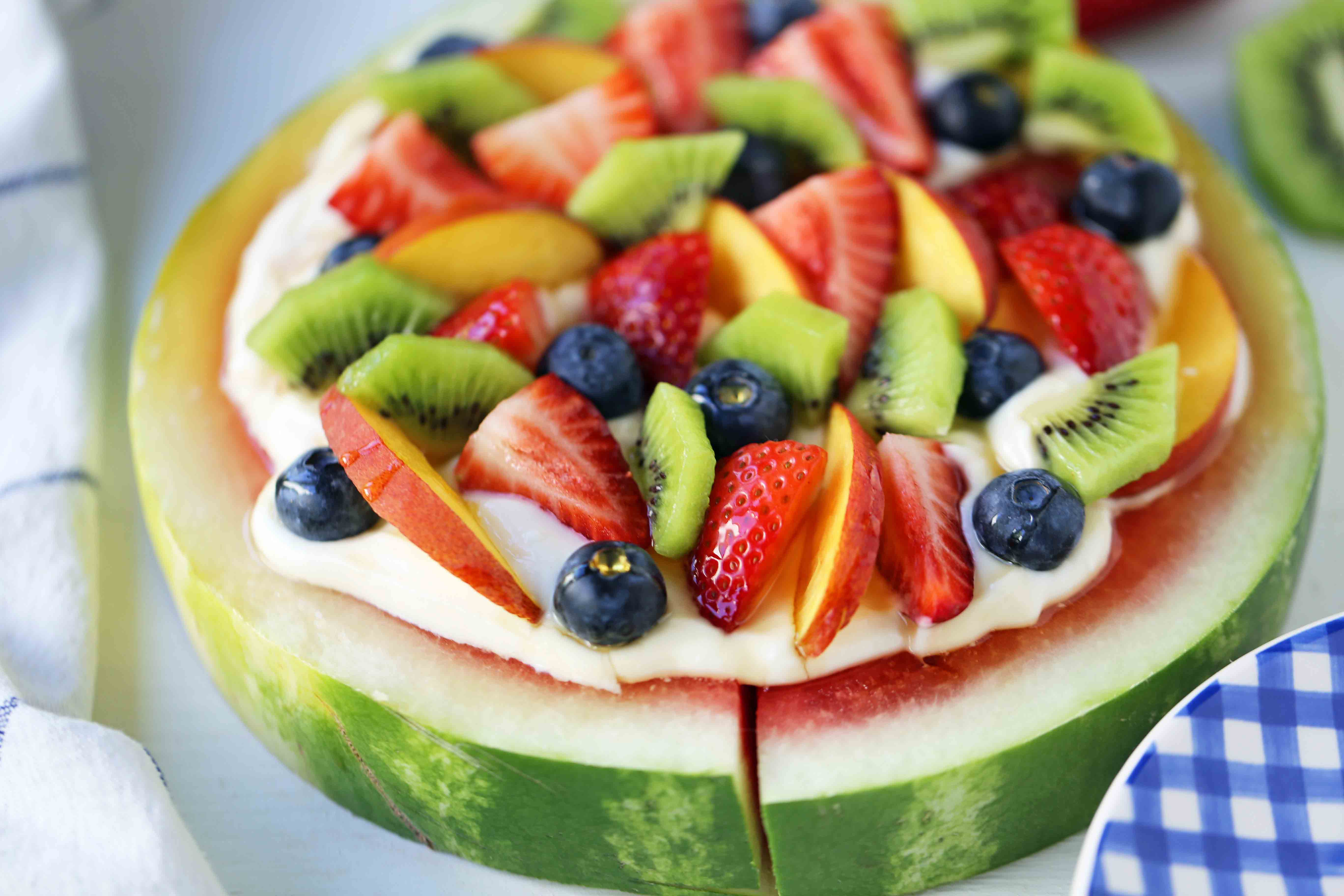 Watermelon Fruit Pizza Cake. A healthy, no-guilt summer dessert recipe. Fresh fruit dessert. The ultimate watermelon and fresh fruit dessert. www.modernhoney.com #fruit #fruitdessert #freshfruit #summer #summerdessert