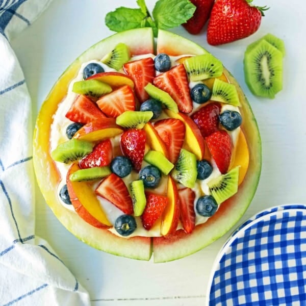 Watermelon Fruit Pizza Cake. A healthy, no-guilt summer dessert recipe. Fresh fruit dessert. The ultimate watermelon and fresh fruit dessert. www.modernhoney.com #fruit #fruitdessert #freshfruit #summer #summerdessert