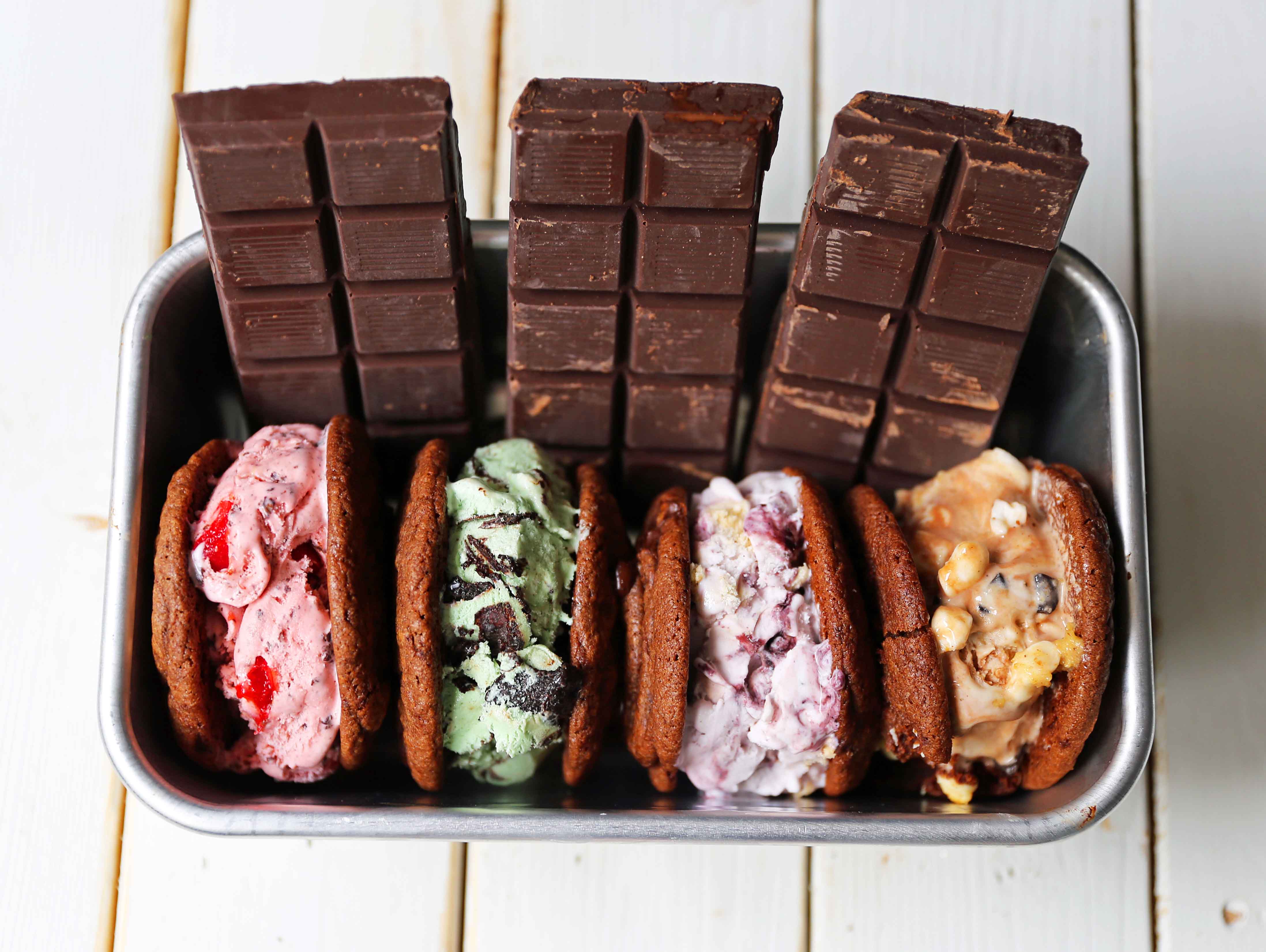 Chocolate Cookie Ice Cream Sandwiches. Soft double chocolate cookies stuffed with your favorite ice cream. How to make the perfect chocolate ice cream sandwich. www.modernhoney.com #icecreamcookiesandwich #icecreamsandwich