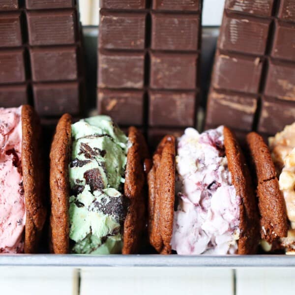 Chocolate Cookie Ice Cream Sandwiches. Soft double chocolate cookies stuffed with your favorite ice cream. How to make the perfect chocolate ice cream sandwich. www.modernhoney.com #icecreamcookiesandwich #icecreamsandwich