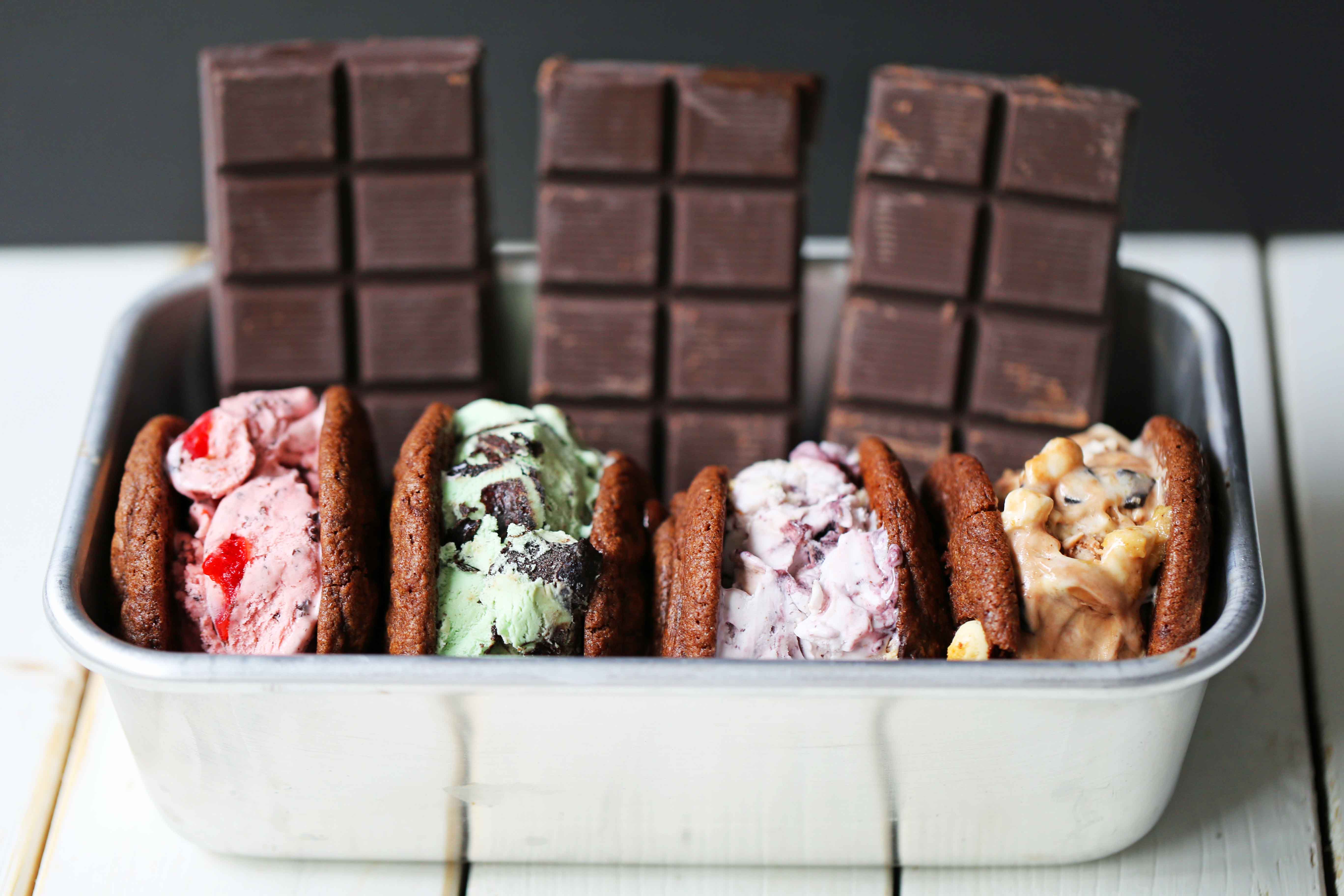 Chocolate Cookie Ice Cream Sandwiches. Soft double chocolate cookies stuffed with your favorite ice cream. How to make the perfect chocolate ice cream sandwich. www.modernhoney.com #icecreamcookiesandwich #icecreamsandwich