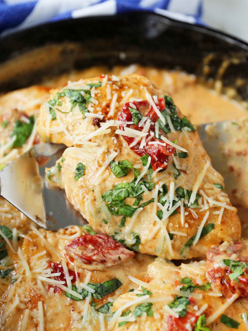 Skillet Chicken with Sun-Dried Tomato Cream Sauce. 20-Minute Chicken made with garlic butter sun-dried tomato parmesan cheese cream sauce. The most flavorful chicken and sauce! You will want to drink the sauce...its THAT GOOD! www.modernhoney.com