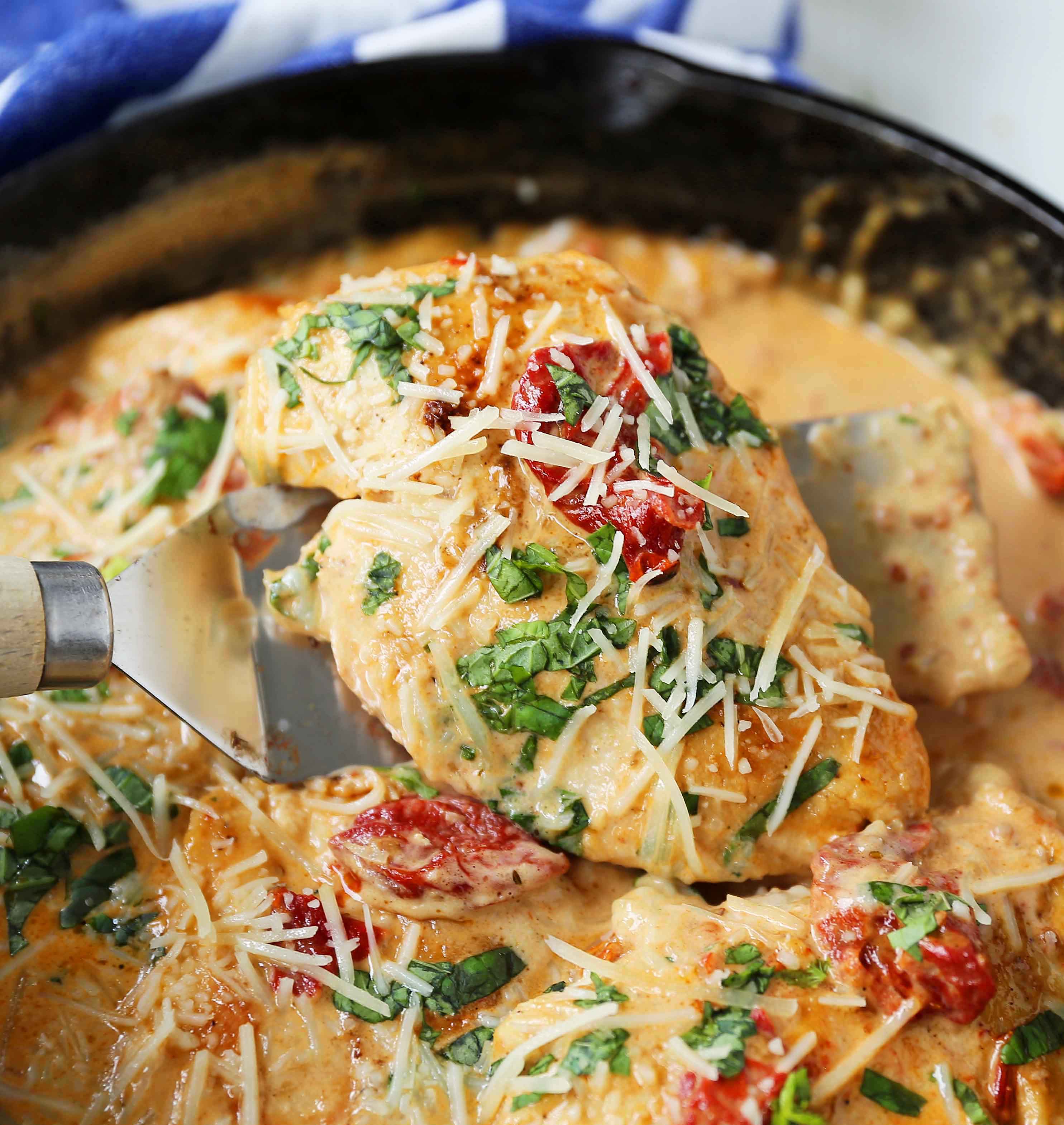 Skillet Chicken with Sun-Dried Tomato Cream Sauce. 20-Minute Chicken made with garlic butter sun-dried tomato parmesan cheese cream sauce. The most flavorful chicken and sauce! You will want to drink the sauce...its THAT GOOD! www.modernhoney.com