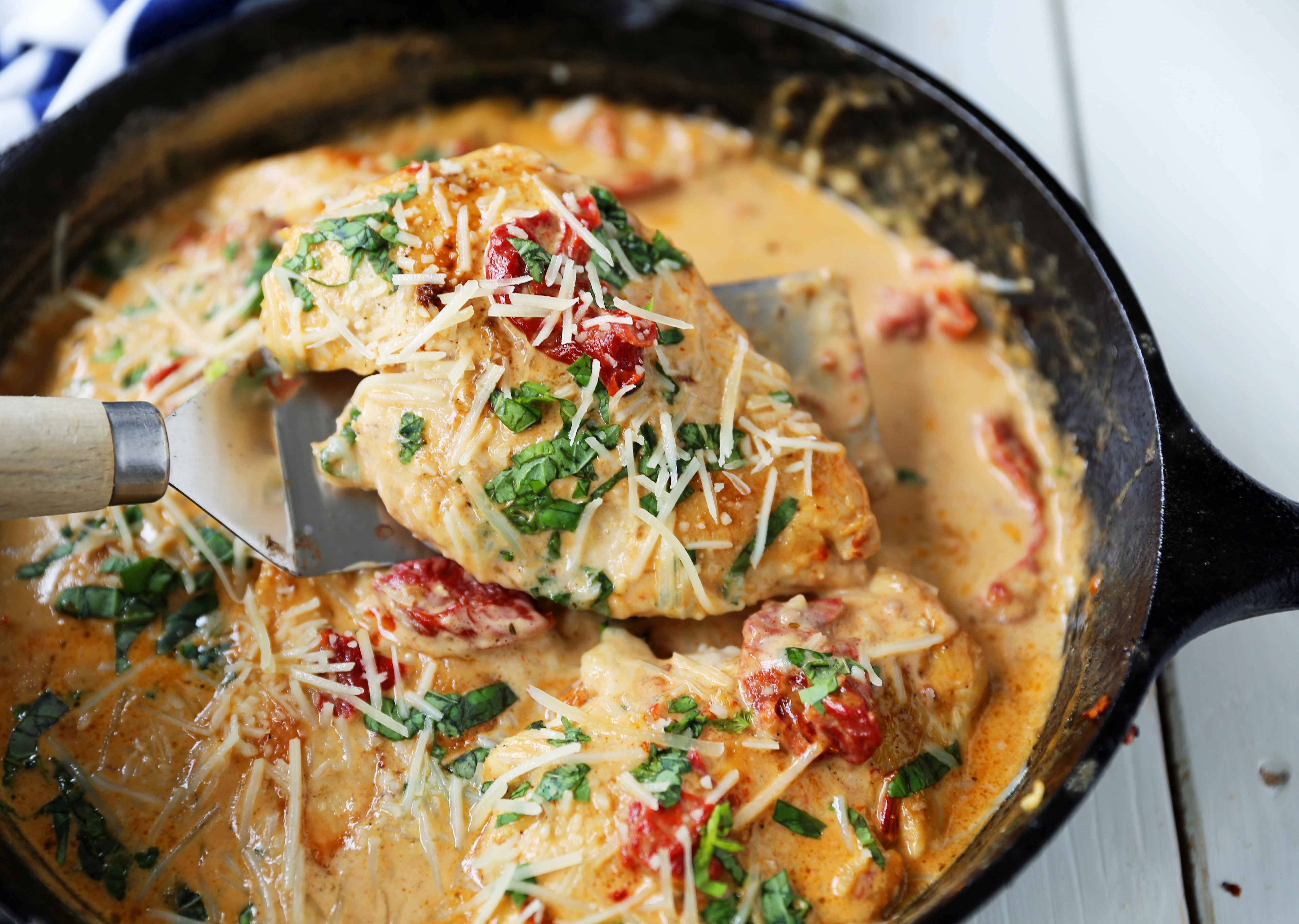 Skillet Chicken with Sun-Dried Tomato Cream Sauce. 20-Minute Chicken made with garlic butter sun-dried tomato parmesan cheese cream sauce. The most flavorful chicken and sauce! You will want to drink the sauce...its THAT GOOD! www.modernhoney.com