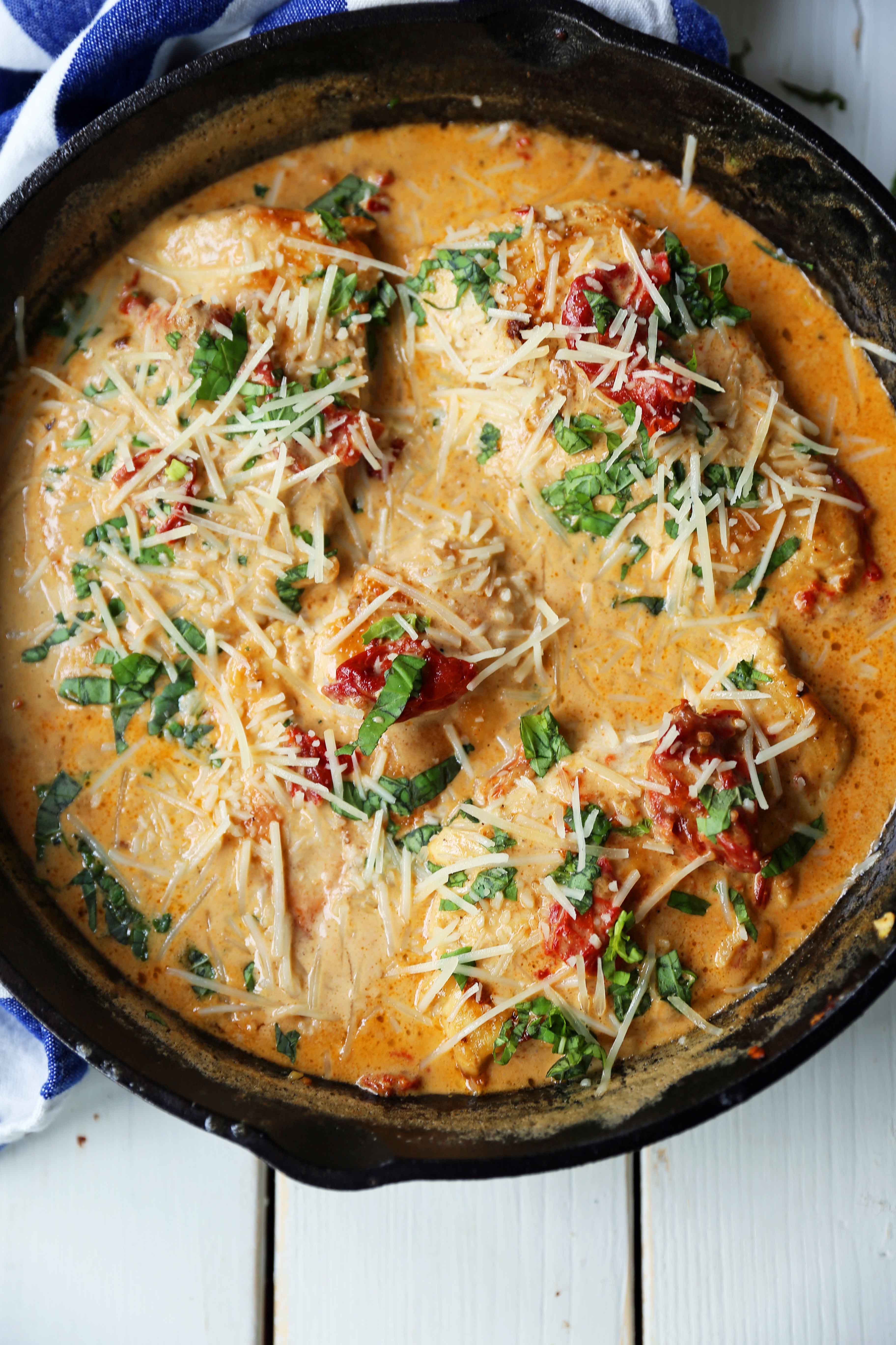 Skillet Chicken with Sun-Dried Tomato Cream Sauce. 20-Minute Chicken made with garlic butter sun-dried tomato parmesan cheese cream sauce. The most flavorful chicken and sauce! You will want to drink the sauce...its THAT GOOD! www.modernhoney.com