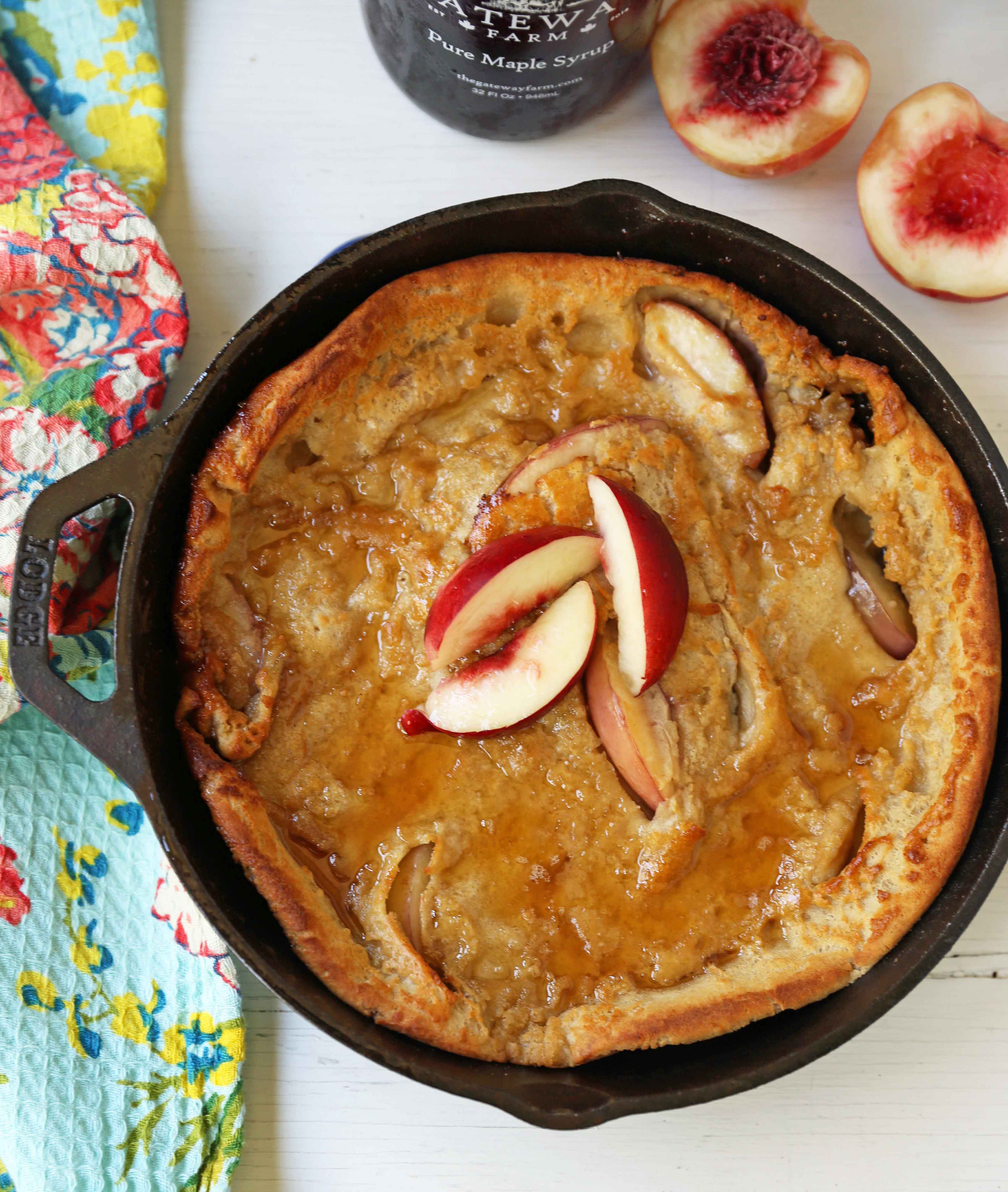 Brown Sugar Peach Dutch Baby Recipe. Sweet Peach and Browned Butter Dutch Baby Pancake. How to make a Peach Dutch Baby. www.modernhoney.com #dutchbaby #puffedpancake #peachpancake #peachdutchbaby 