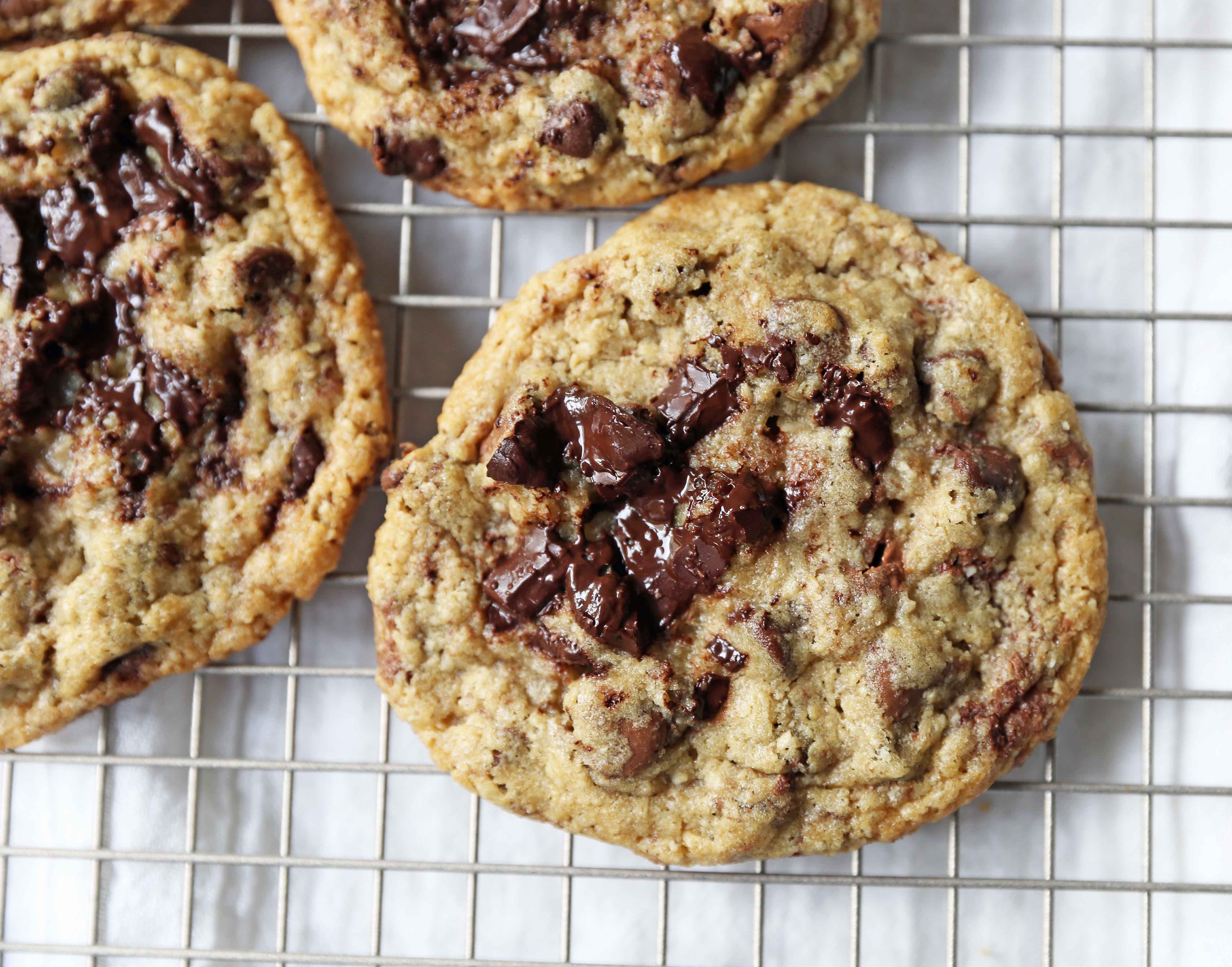 Chocolate Chip Oatmeal Cookies Recipe. Chocolate chip cookies with ground oatmeal have the perfect chewy, crispy texture. This NYC Milk and Cookies Bakery Copycat Cookie Recipe will become a favorite in no time at all! www.modernhoney.com #chocolatechipcookies #chocolatechipoatmealcookies