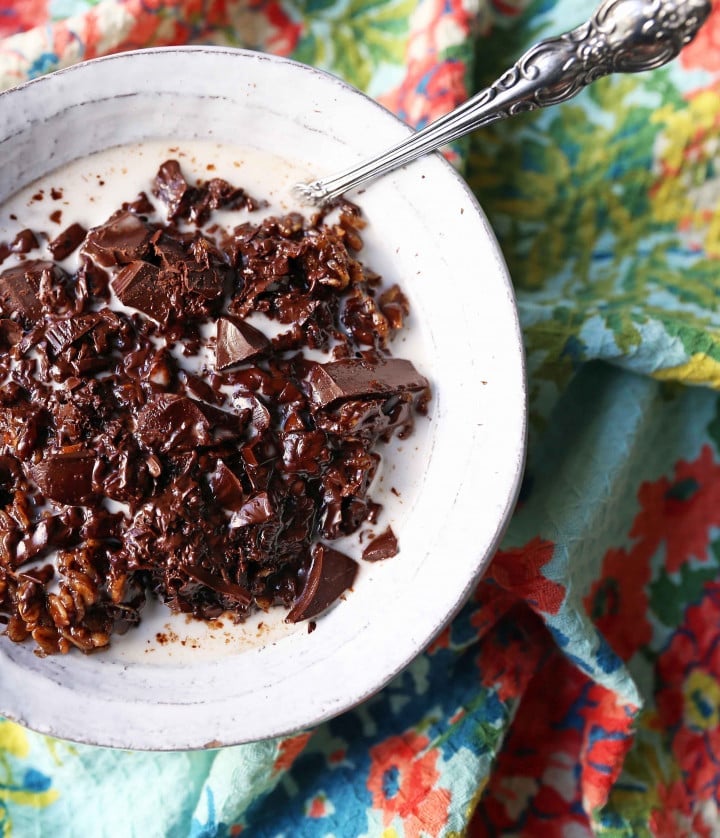 Decadent double chocolate oatmeal is made with rolled oats mixed with creamy coconut milk, cocoa, lightly sweetened, and topped with chocolate chunks. These creamy chocolate oats are a rich, heavenly breakfast!