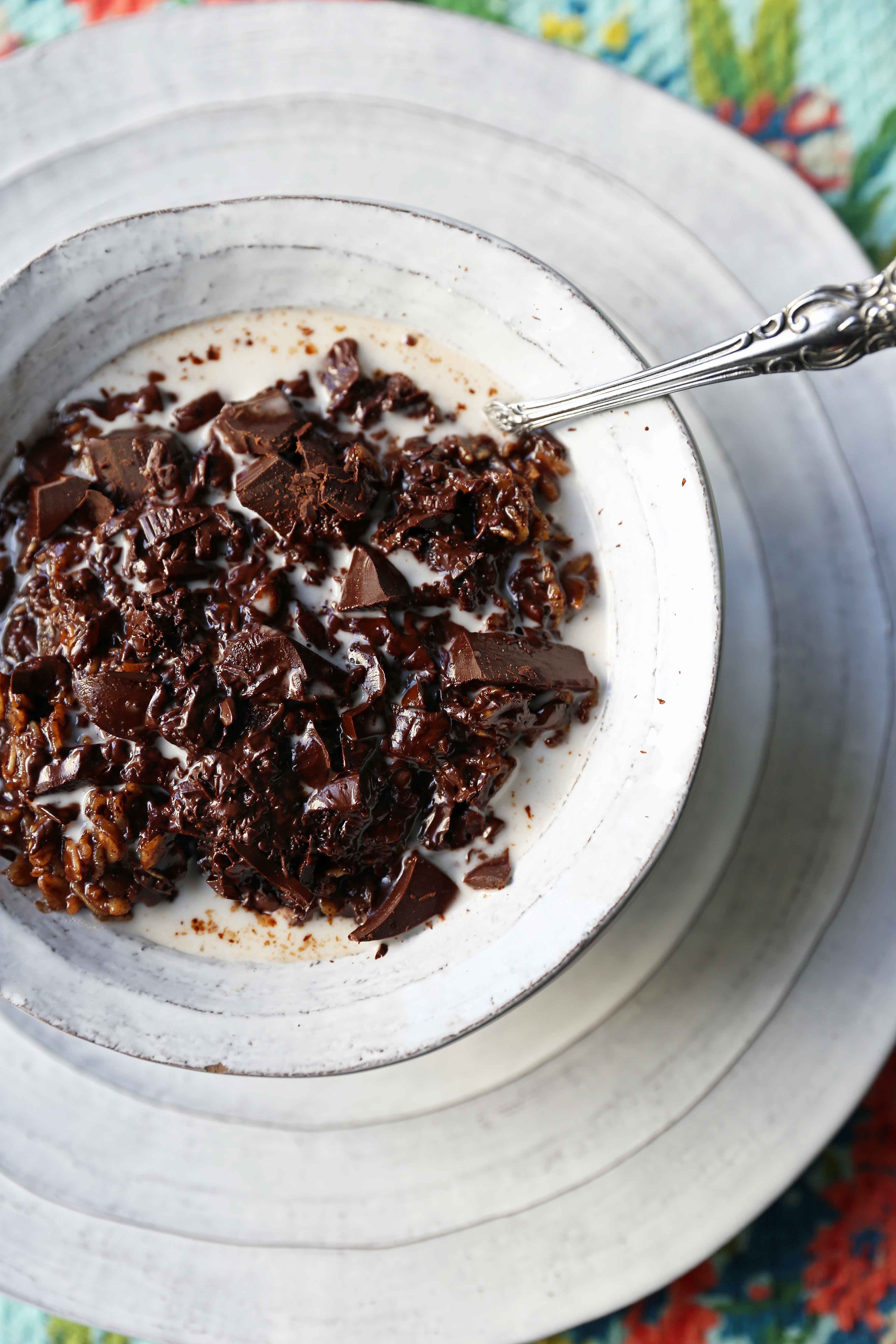 A bowl of decadent double chocolate oatmeal is made with rolled oats mixed with creamy coconut milk, cocoa, lightly sweetened, and topped with chocolate chunks. These creamy chocolate oats are a rich, heavenly breakfast!