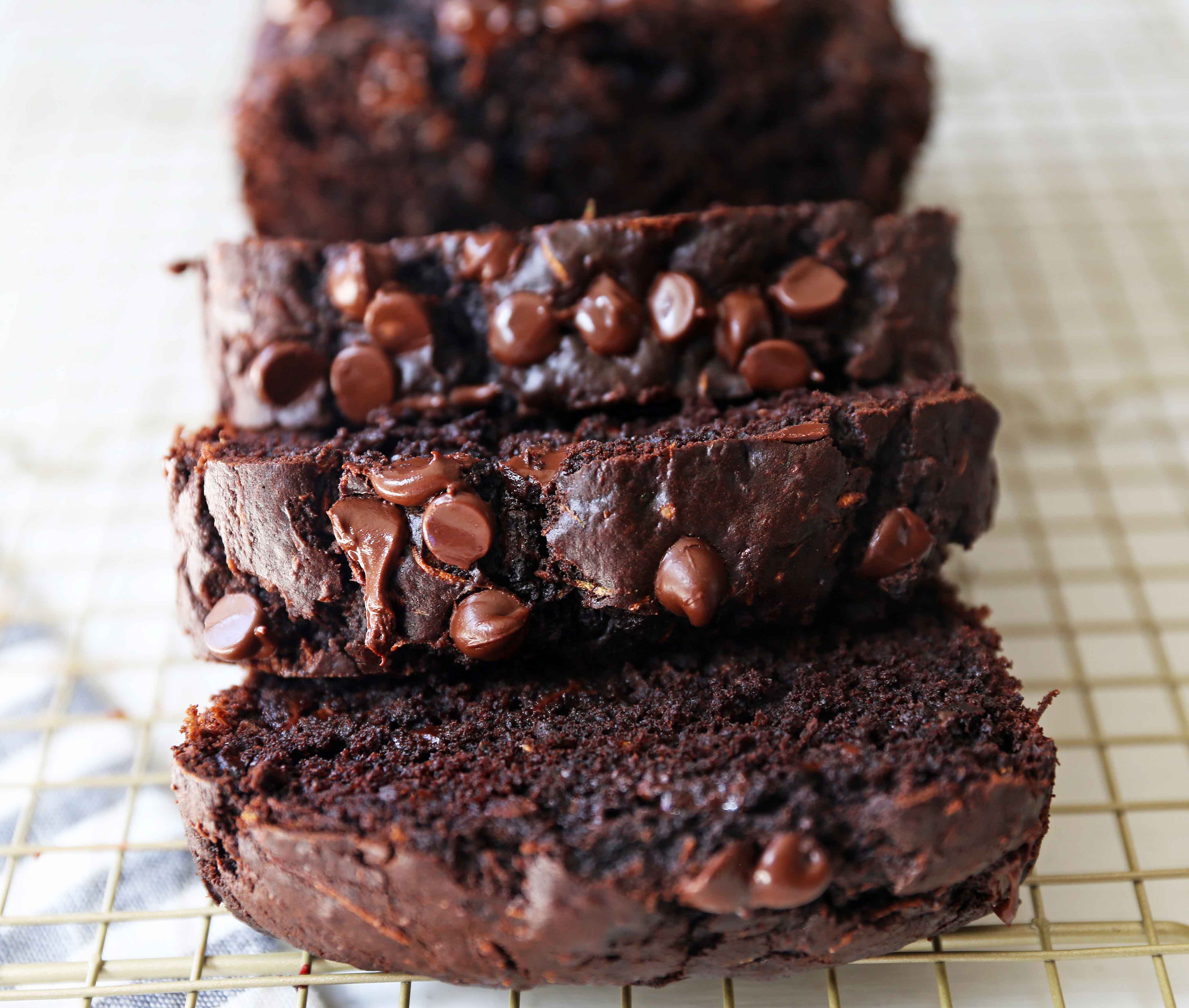 Chocolate Zucchini Bread. A rich double chocolate zucchini bread with chocolate chips recipe. You will never know there is zucchini in this chocolate bread! It is moist, rich, and a chocolate lover's dream! www.modernhoney.com #zucchinibread #chocolatezucchinibread #zucchinirecipes