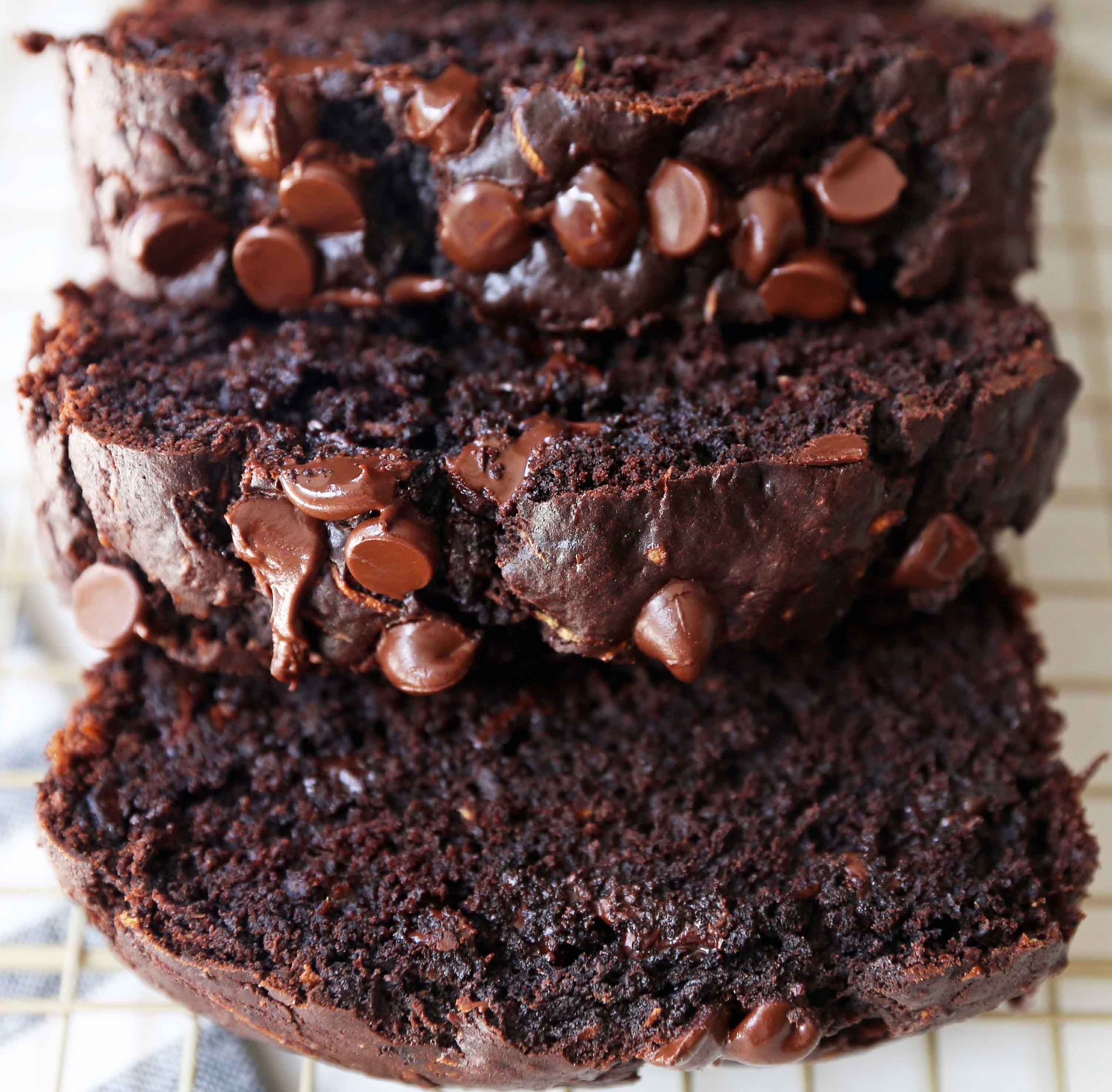 Chocolate Zucchini Bread. A rich double chocolate zucchini bread with chocolate chips recipe. You will never know there is zucchini in this chocolate bread! It is moist, rich, and a chocolate lover's dream! www.modernhoney.com #zucchinibread #chocolatezucchinibread #zucchinirecipes