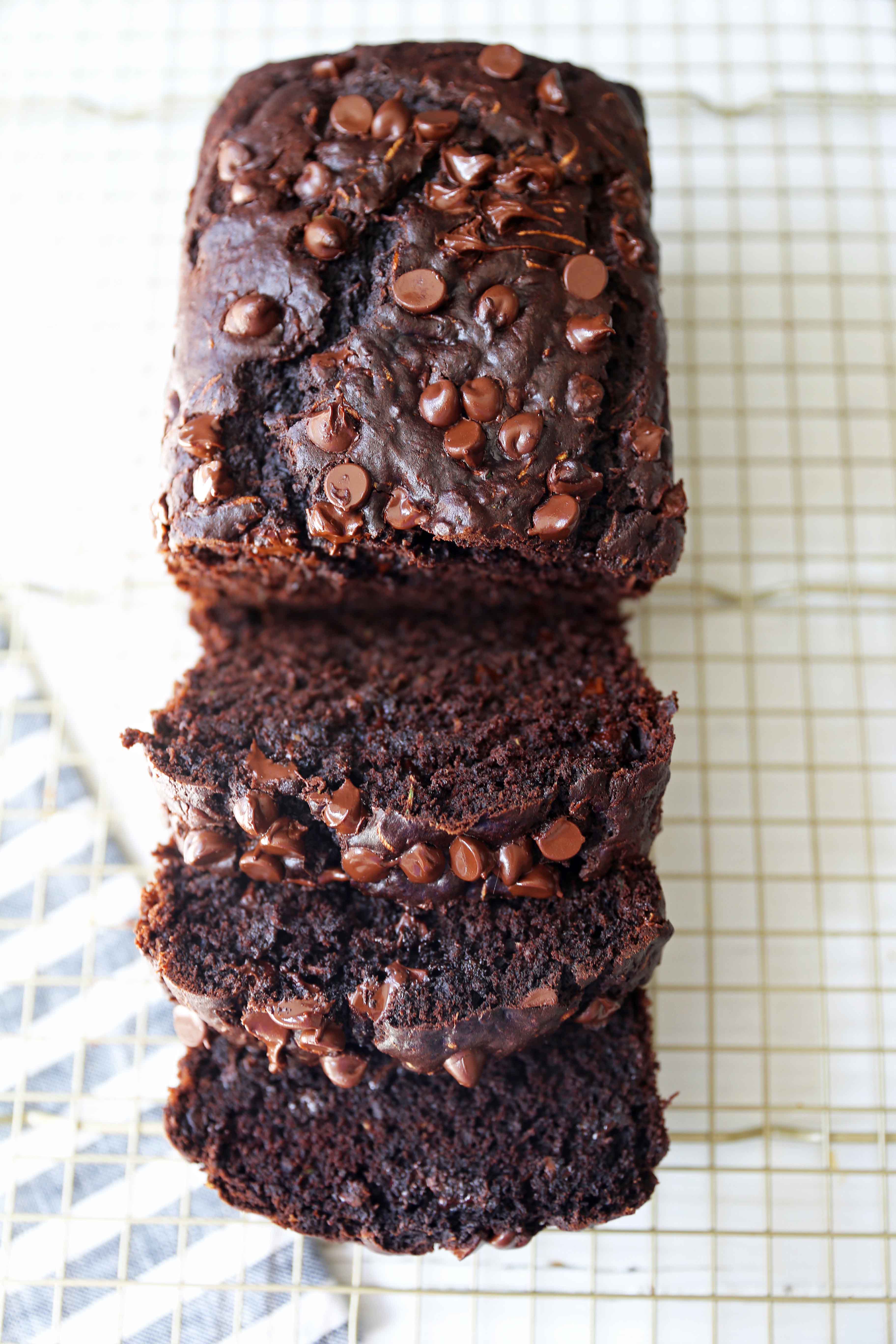 Chocolate Zucchini Bread. A rich double chocolate zucchini bread with chocolate chips recipe. You will never know there is zucchini in this chocolate bread! It is moist, rich, and a chocolate lover's dream! www.modernhoney.com #zucchinibread #chocolatezucchinibread #zucchinirecipes