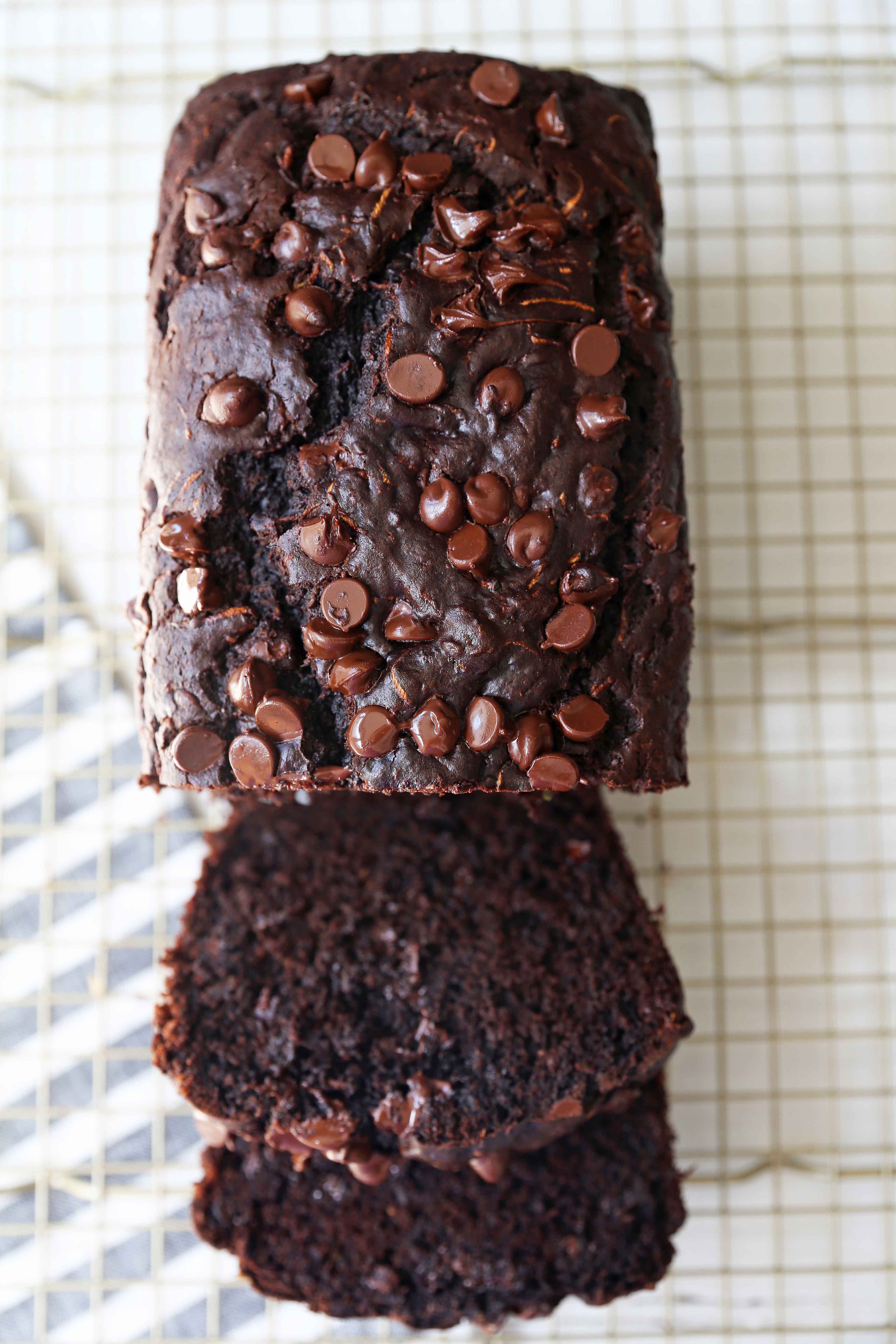 Chocolate Zucchini Bread. A rich double chocolate zucchini bread with chocolate chips recipe. You will never know there is zucchini in this chocolate bread! It is moist, rich, and a chocolate lover's dream! www.modernhoney.com #zucchinibread #chocolatezucchinibread #zucchinirecipes