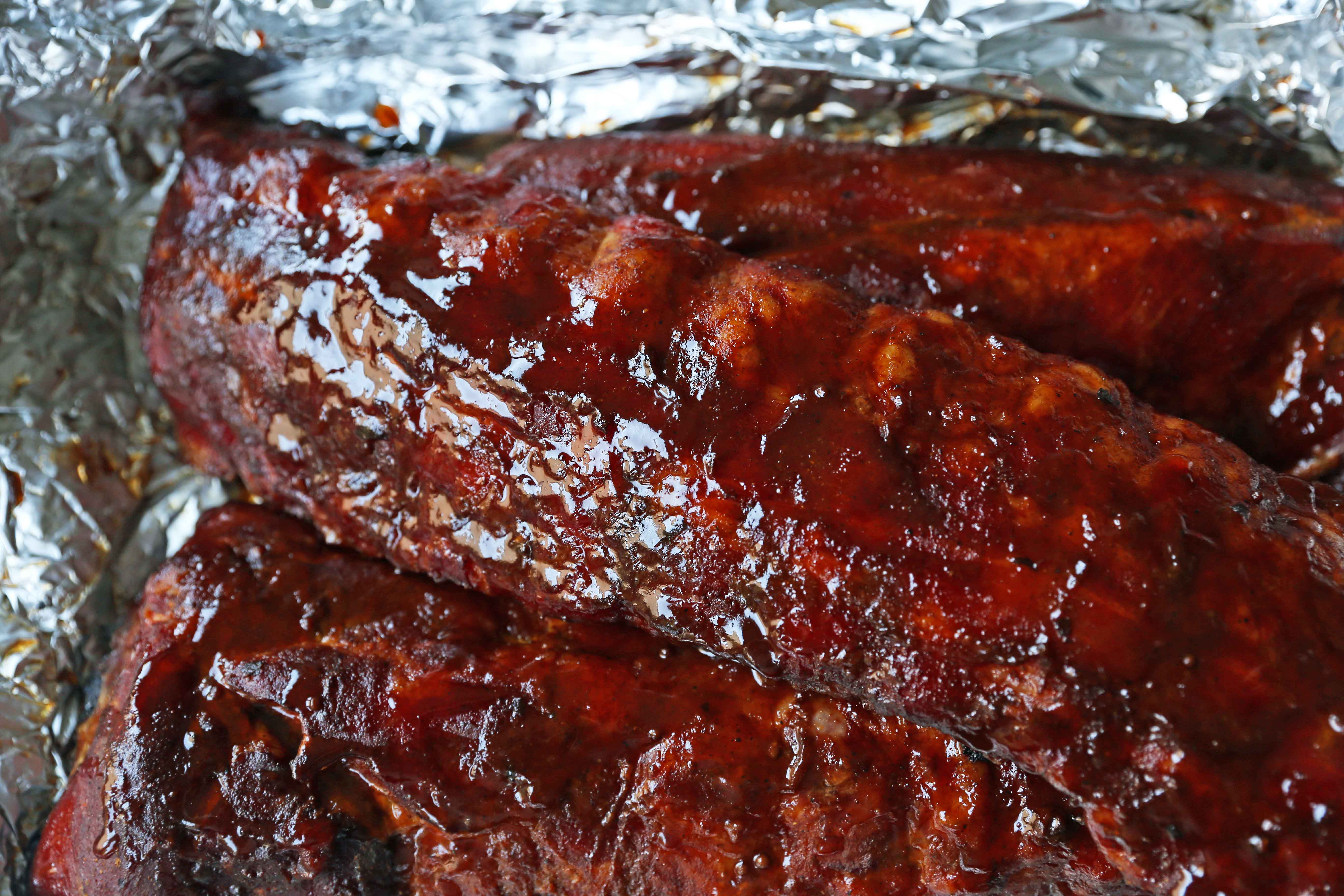 Smoked Baby Back Ribs. Tender, flavorful, fall-off-the-bone Pork Baby Back Ribs. How to smoke ribs or cook in the oven. Perfect BBQ Rub Recipe. #ribs #babybackribs