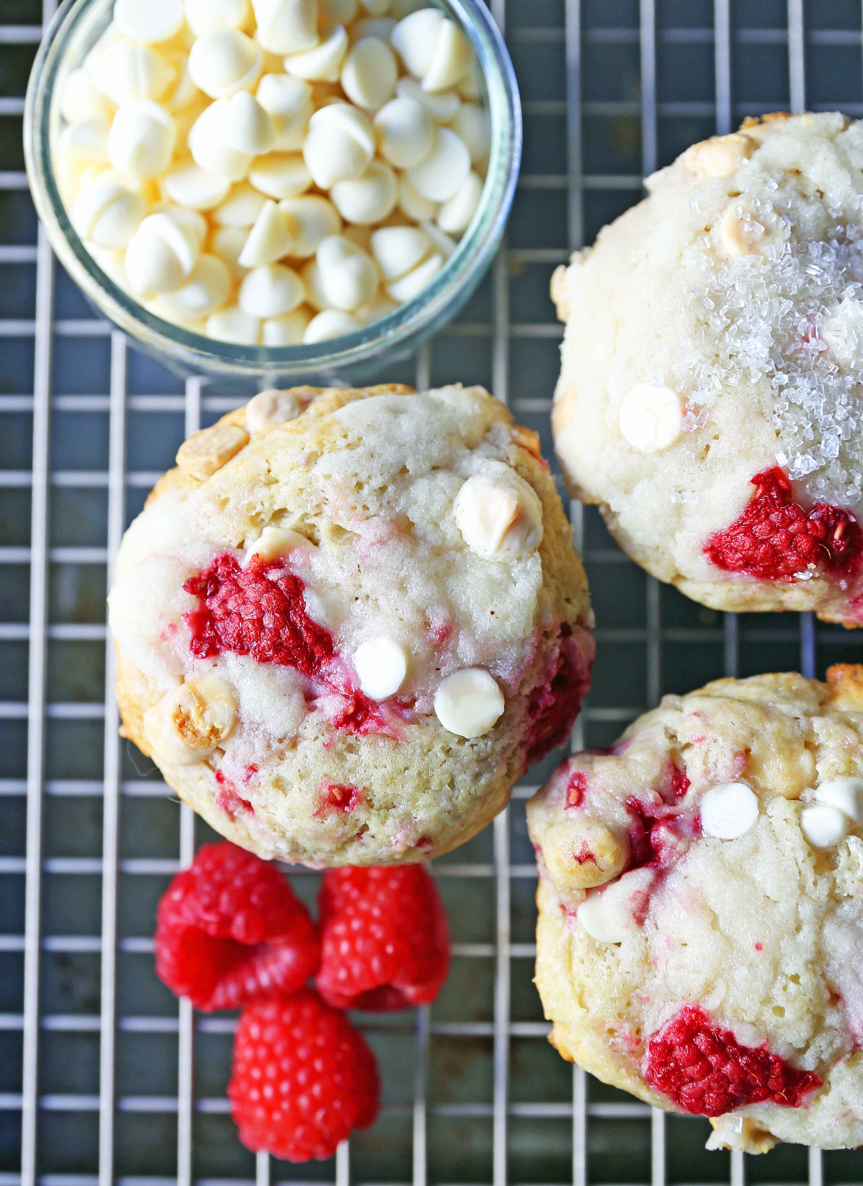 Raspberry White Chocolate Muffins. Soft, moist muffins with fresh raspberries and sweet white chocolate chips. The perfect tart and sweet muffin recipe. Moist raspberry muffins recipe. www.modernhoney.com #raspberrymuffins #muffins #muffinsrecipe