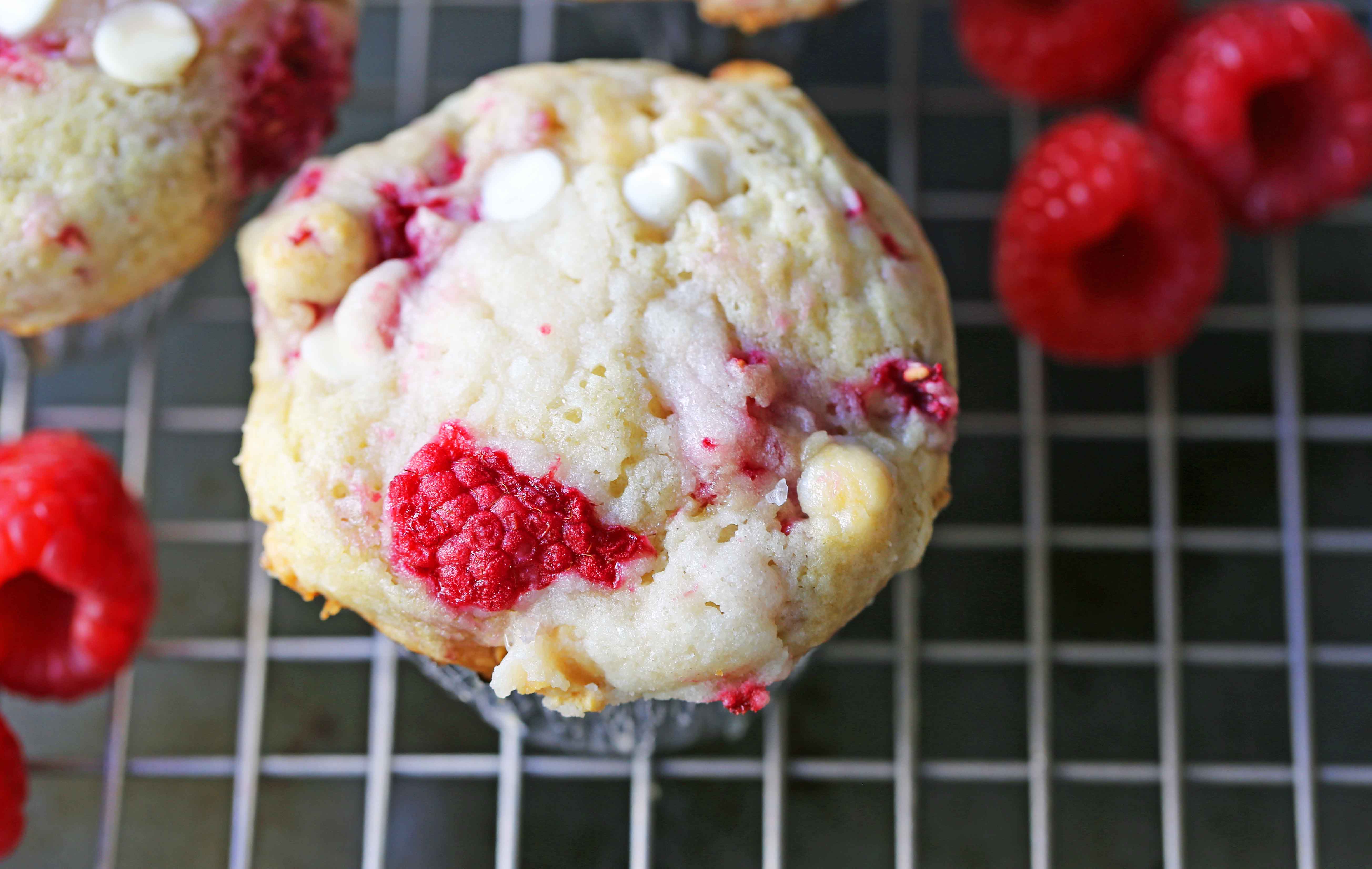 Raspberry White Chocolate Muffins. Soft, moist muffins with fresh raspberries and sweet white chocolate chips. The perfect tart and sweet muffin recipe. Moist raspberry muffins recipe. www.modernhoney.com #raspberrymuffins #muffins #muffinsrecipe