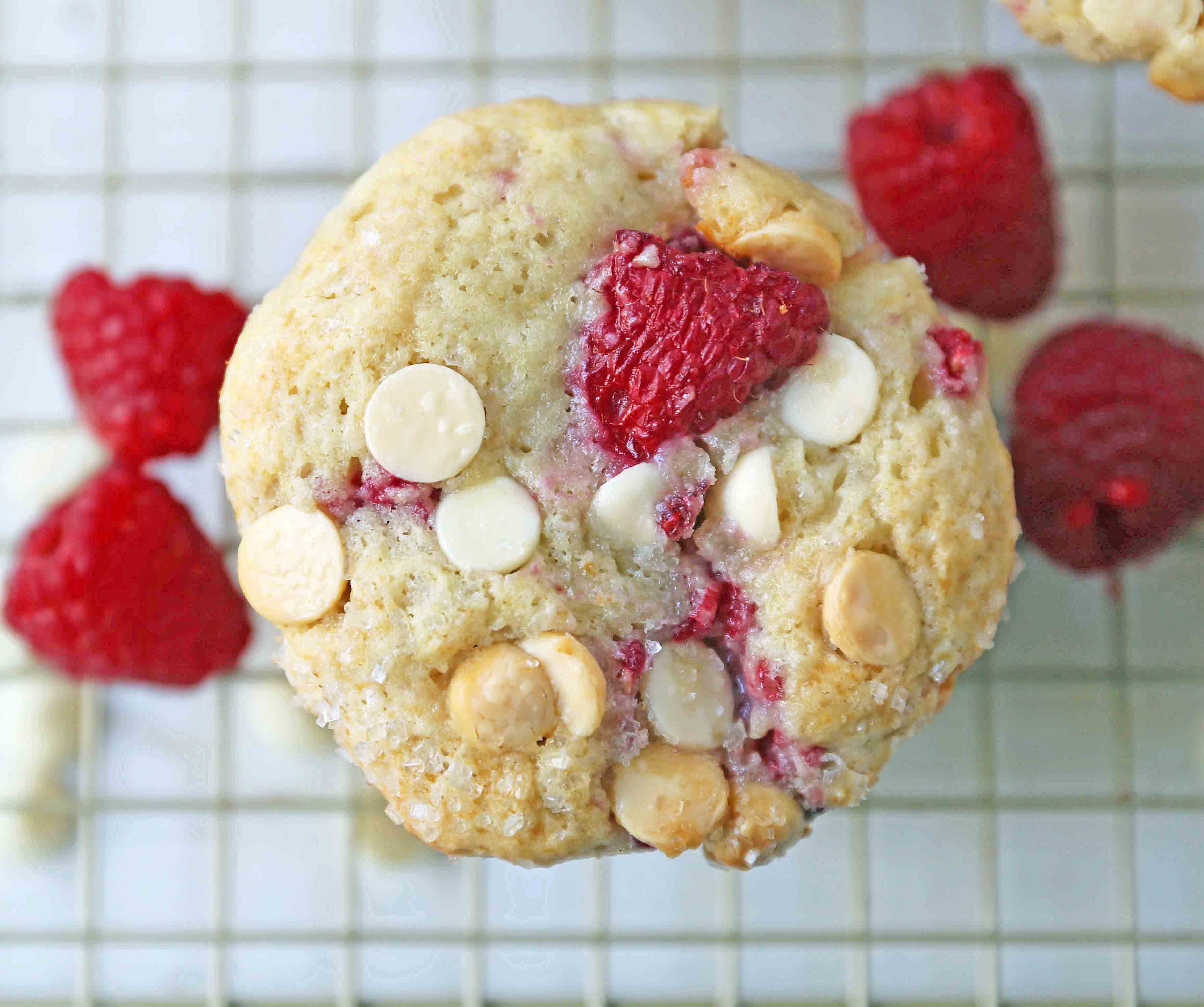 Raspberry White Chocolate Muffins. Soft, moist muffins with fresh raspberries and sweet white chocolate chips. The perfect tart and sweet muffin recipe. Moist raspberry muffins recipe. www.modernhoney.com #raspberrymuffins #muffins #muffinsrecipe