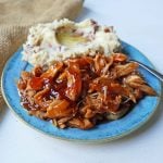 Slow Cooker Peach Barbecue Sauce Chicken. 5-Ingredient Crockpot Chicken with Sweet Peach BBQ Glaze. A fast and flavorful slow cooker chicken with peach bbq sauce. www.modernhoney.com #slowcooker #crockpot