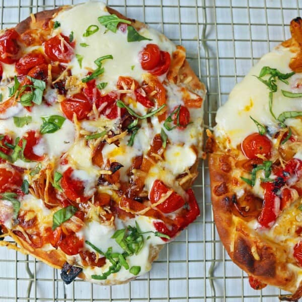 Veggie Pizza Recipe. Homemade veggie pizza with roasted vegetables, mozzarella cheese, and ricotta. Naan Bread Pizza made in 20 minutes! www.modernhoney.com #flatbreadpizza #naanbreadpizza